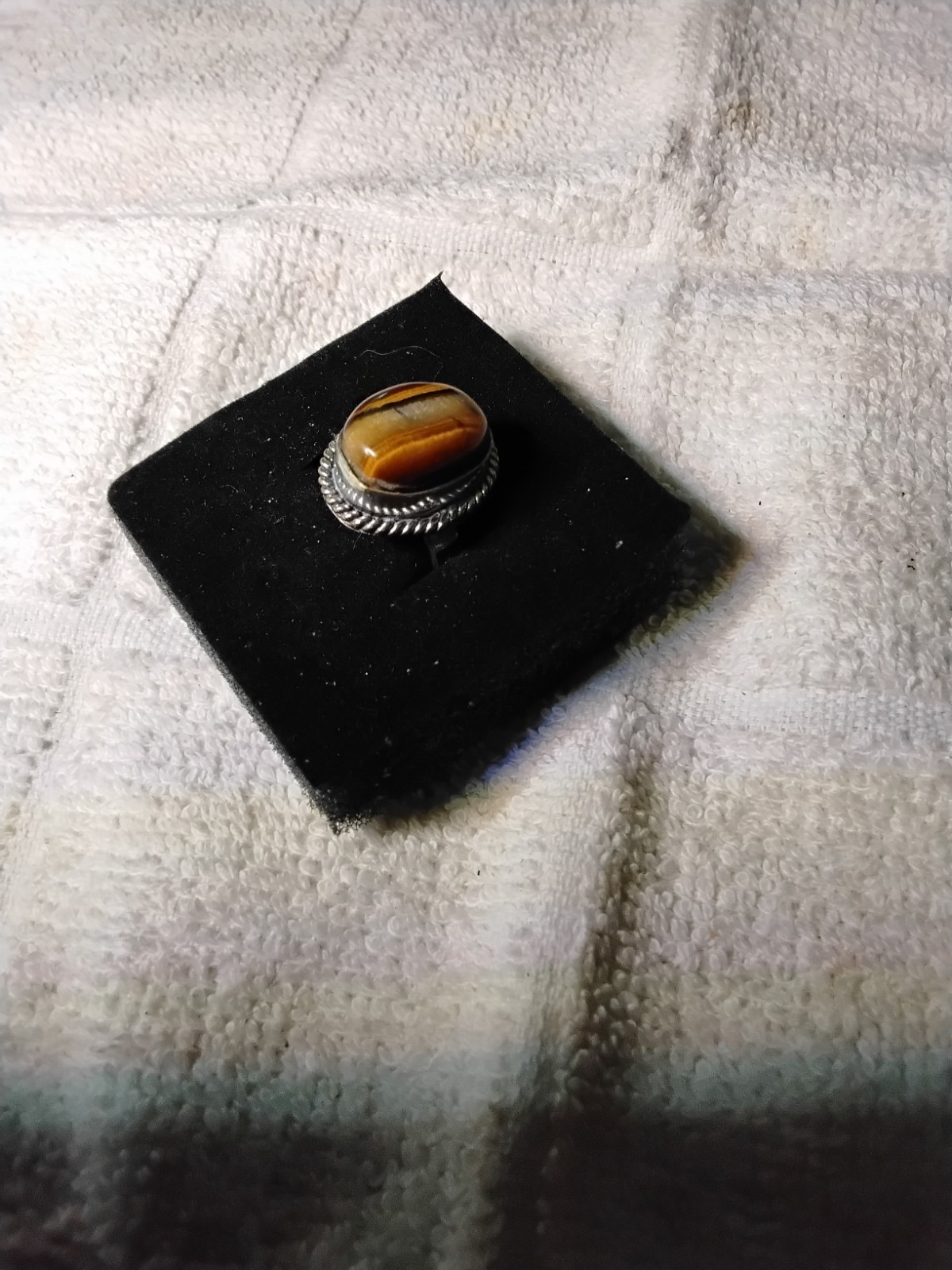 Tiger's Eye Oval Ring Bezel Set In Rhodium Plated Setting. Size 7