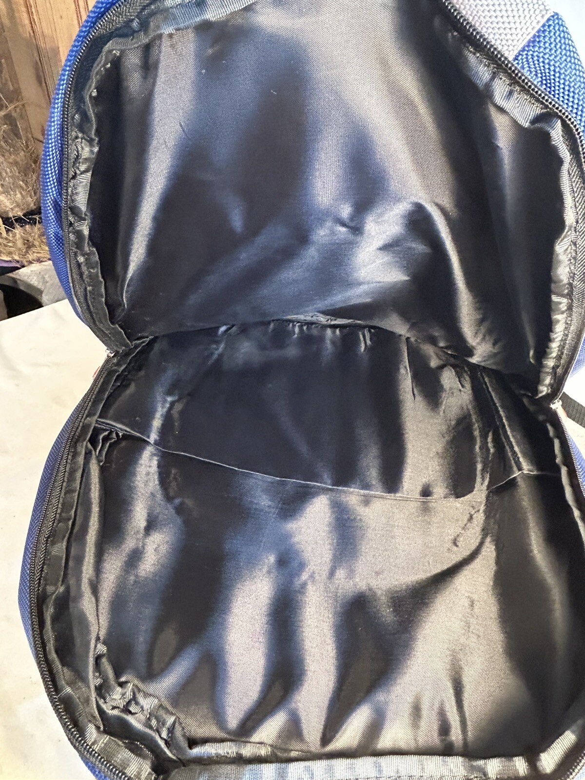 Blue/Grey NGG Swiss Edition Backpack with blue water bottle computer school