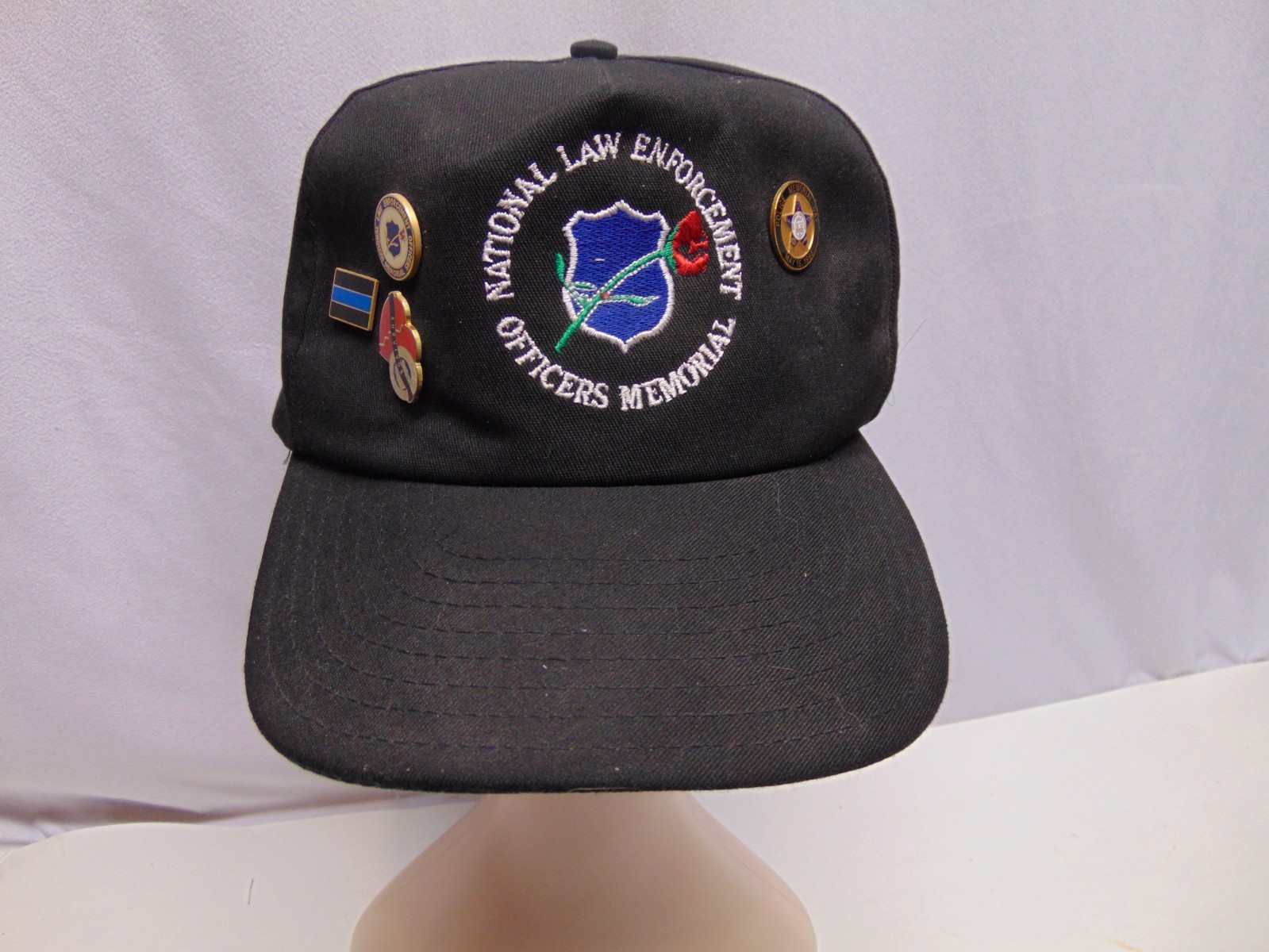 National Law Enforcement officers adjustable Hat w/ 15 police pins on it
