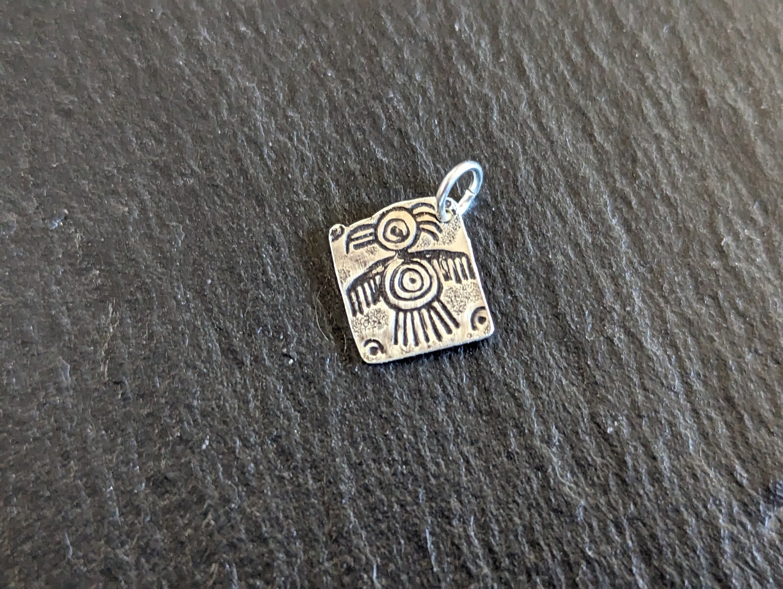 Tiny sterling silver charm with a bird sumbol - handmade - freeform