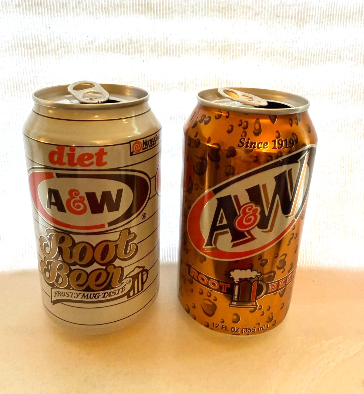 Four A&W Root Beer cans from the 1990's 12oz each