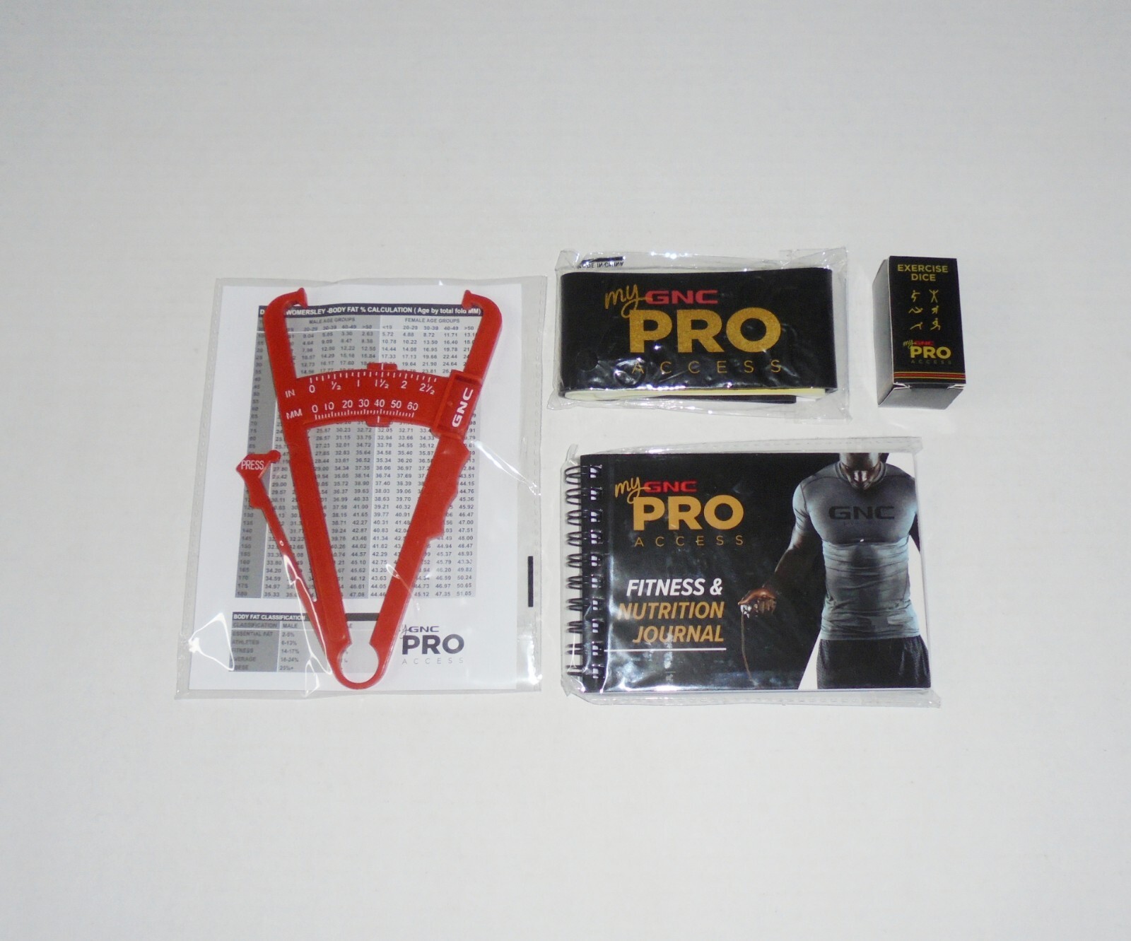 GNC 4 Piece Exercise Fitness Training Bundle Body Fat Caliper Stretch Bands Dice