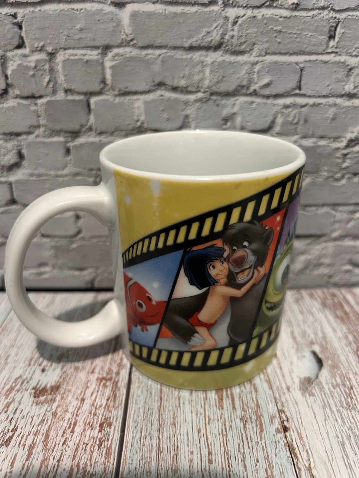DISNEY KINNERTON FILM STRIP CHARACTERS NEMO SIMBA BUZZ WOODY KIDS MUG(3.5”T)