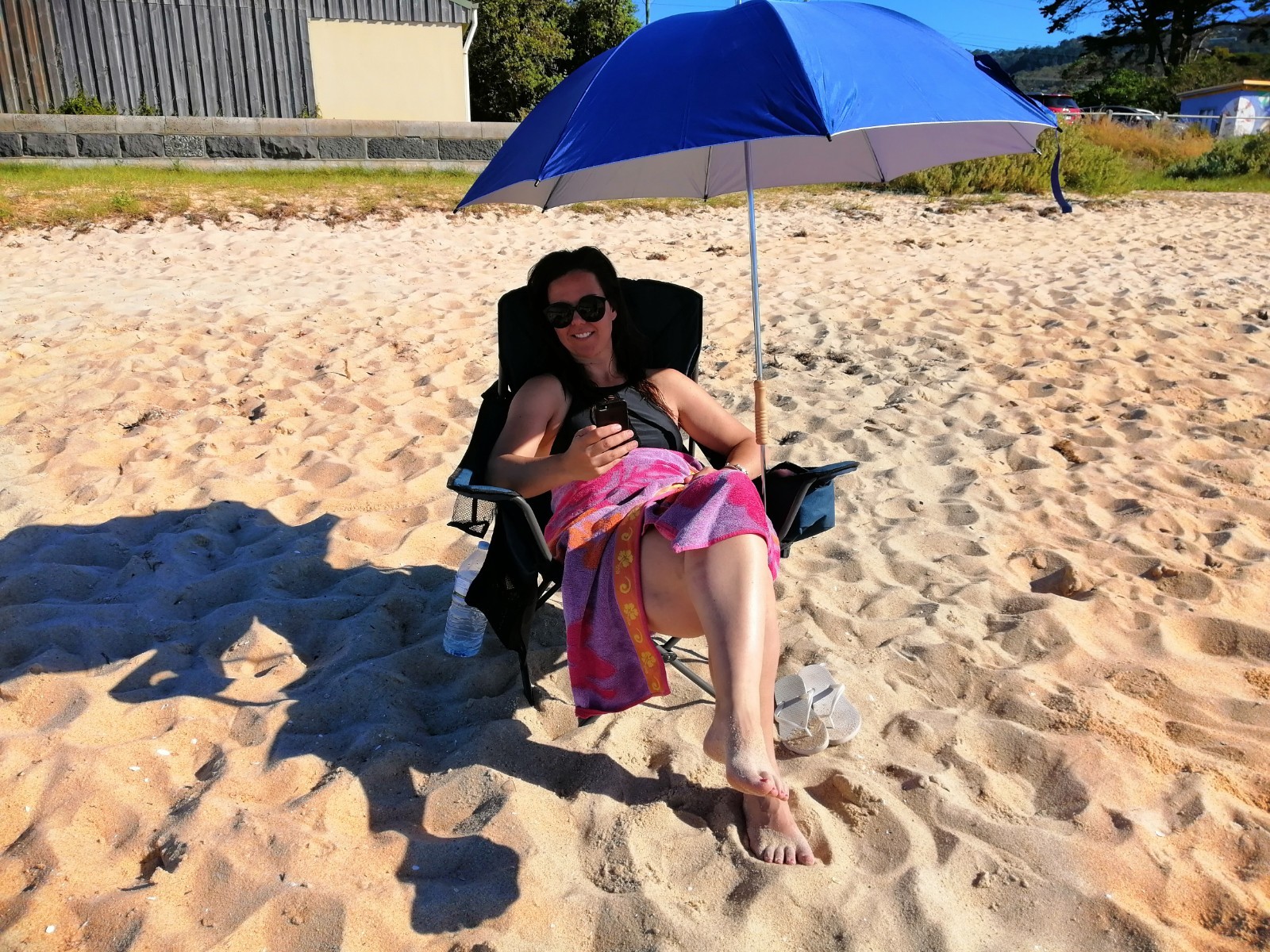 Golf umbrella with pole inside main pole for pushing into sand or soil, carrybag