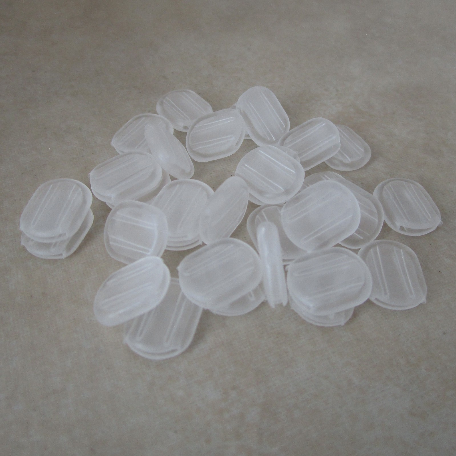 24 small clear comfort cushion pads for clip on earclips 10mm long x 8mm wide