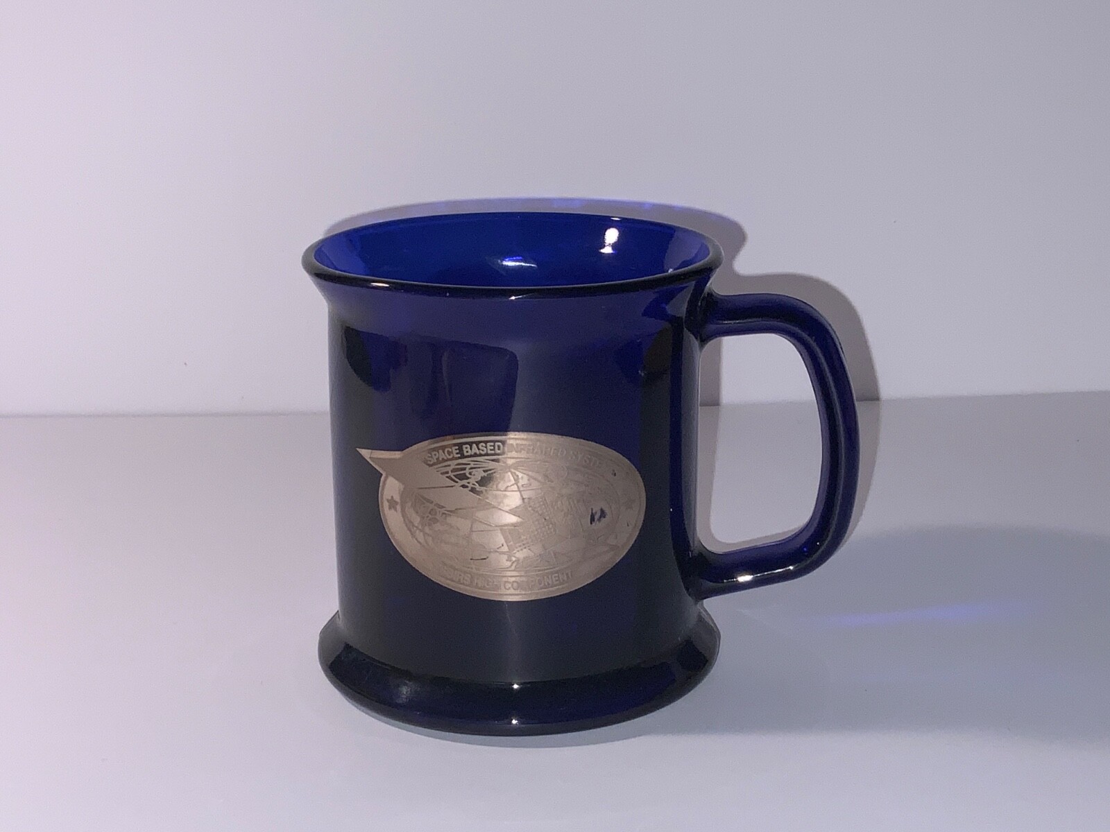 TRW SPACE BASED INFRARED SYSTEM MUG. SBIRS HIGH COMPONENT MUG BLUE GLASS