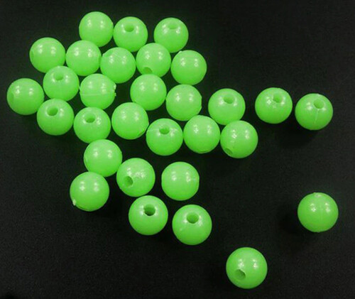 Twenty five (25) 12mm round glow-in-the-dark green fishing rig beads
