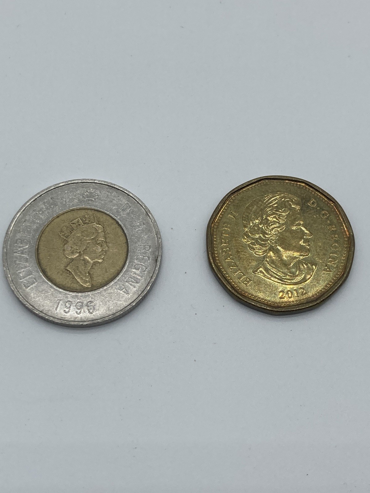Lot of 2 Canadian Coins 2012 Loon $1 Coin and 1996 Bimetallic $2 Dollar toning