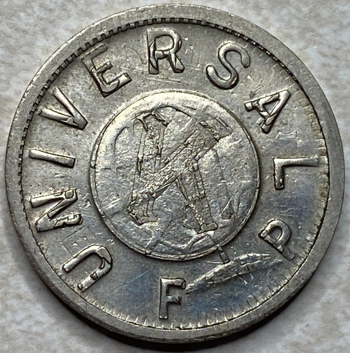 Universal FP  F P overstruck St Paul MN Minnesota Token T5960