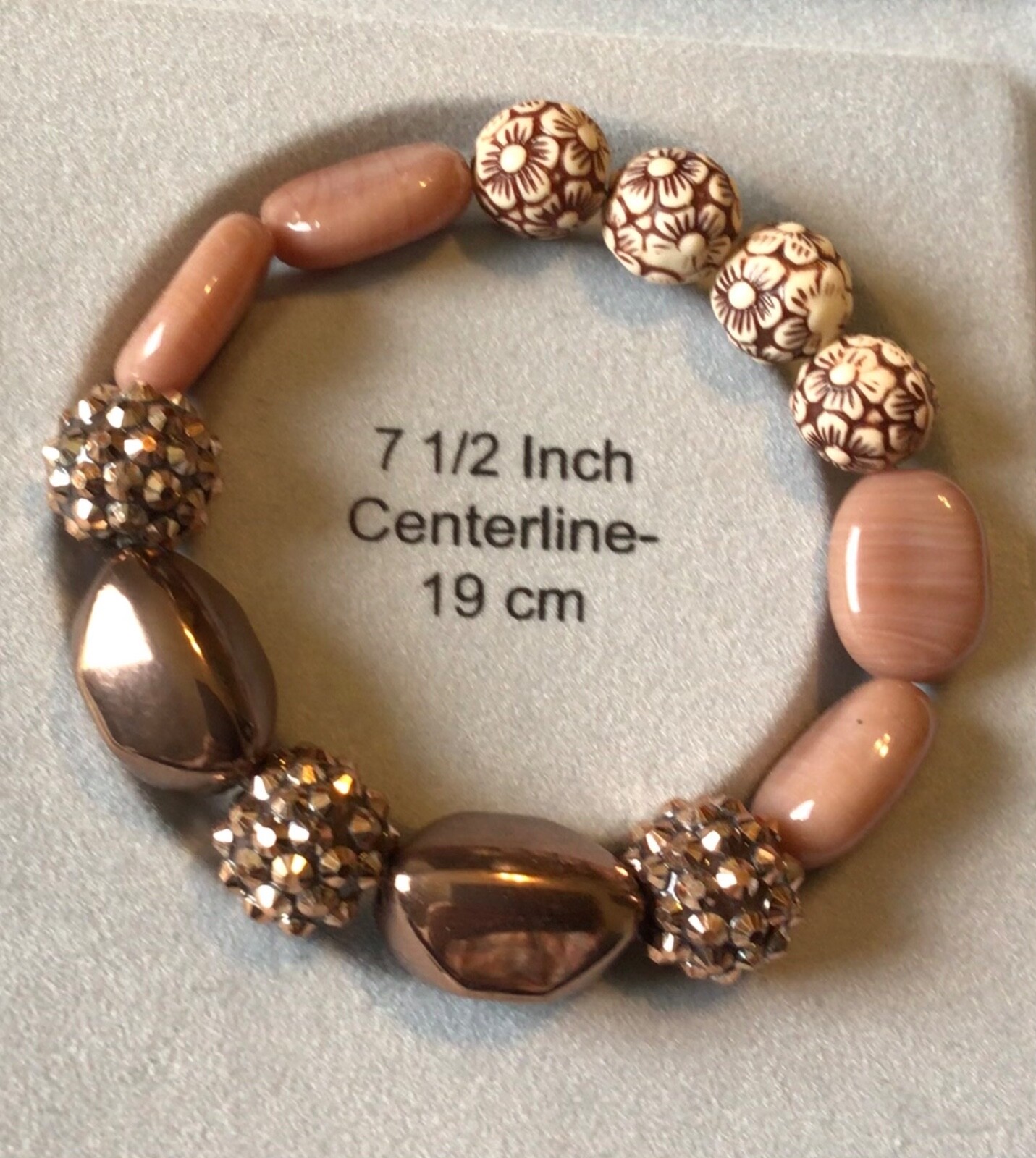 7.5” stretch bracelet w/brown beads and baubles, Made in the USA
