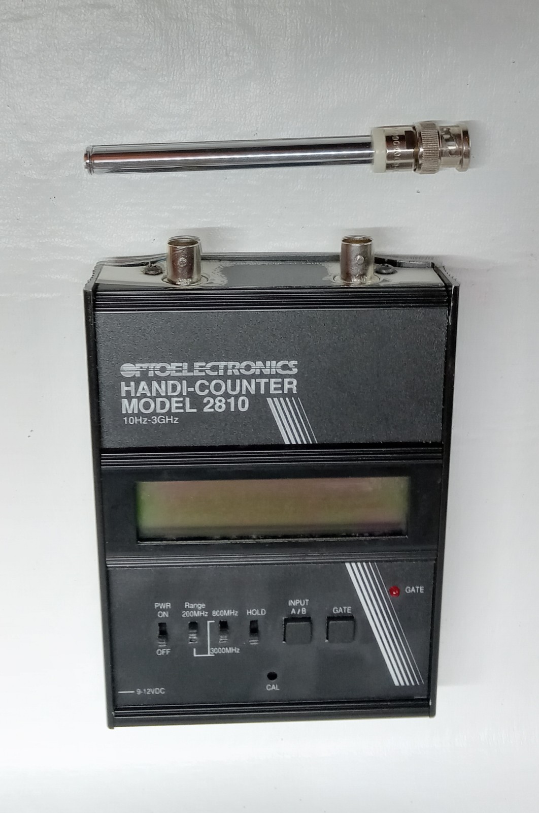 Optoelectronics Handi-Counter Model 2810 Portable Frequency Counter with Manual