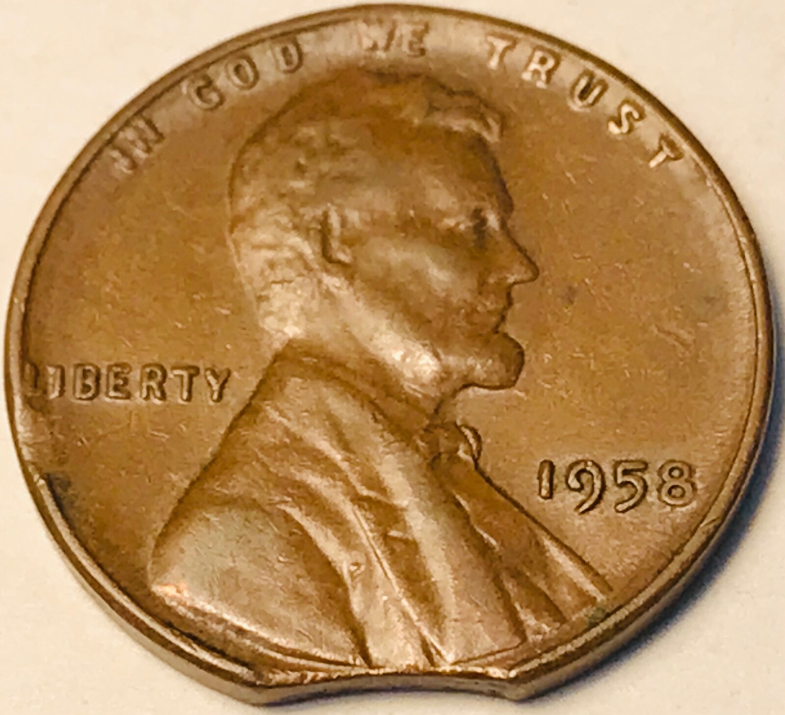 1958 Lincoln Wheat cent with curved clip and micro clip