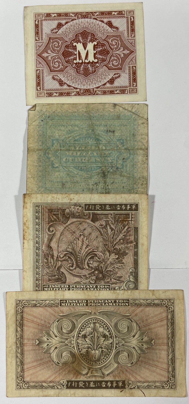 Military currency 8 different pcs. (#472) includes one US. Mixed quality.