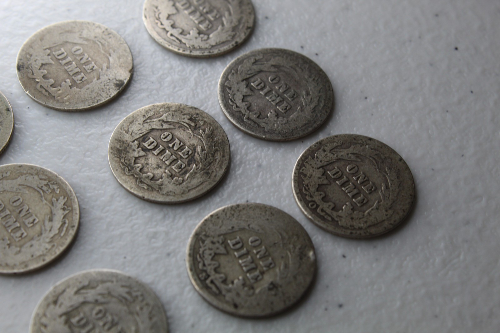 12 Very Old Very Worn Barber Dimes with dates