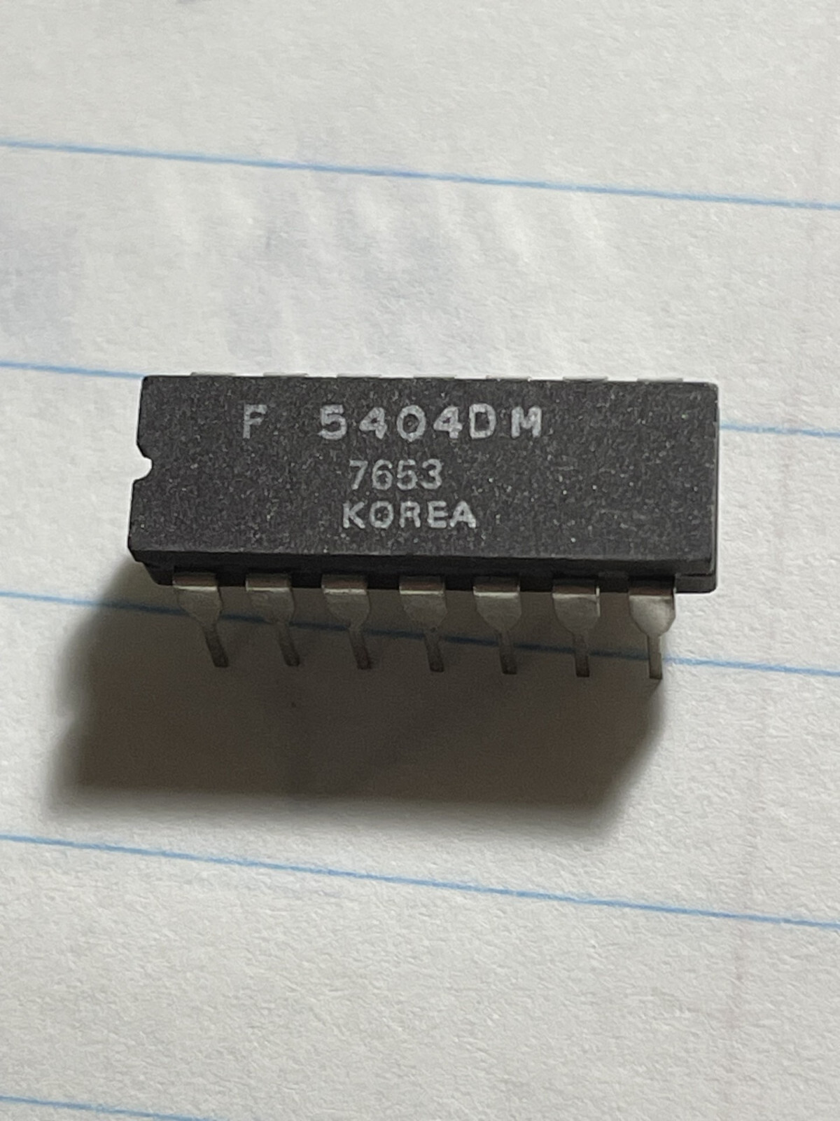 ONE (1)  SN5404J  or  SN5406J or S5474F or S54121DM Mil-STD TTL logic;  CDIP.