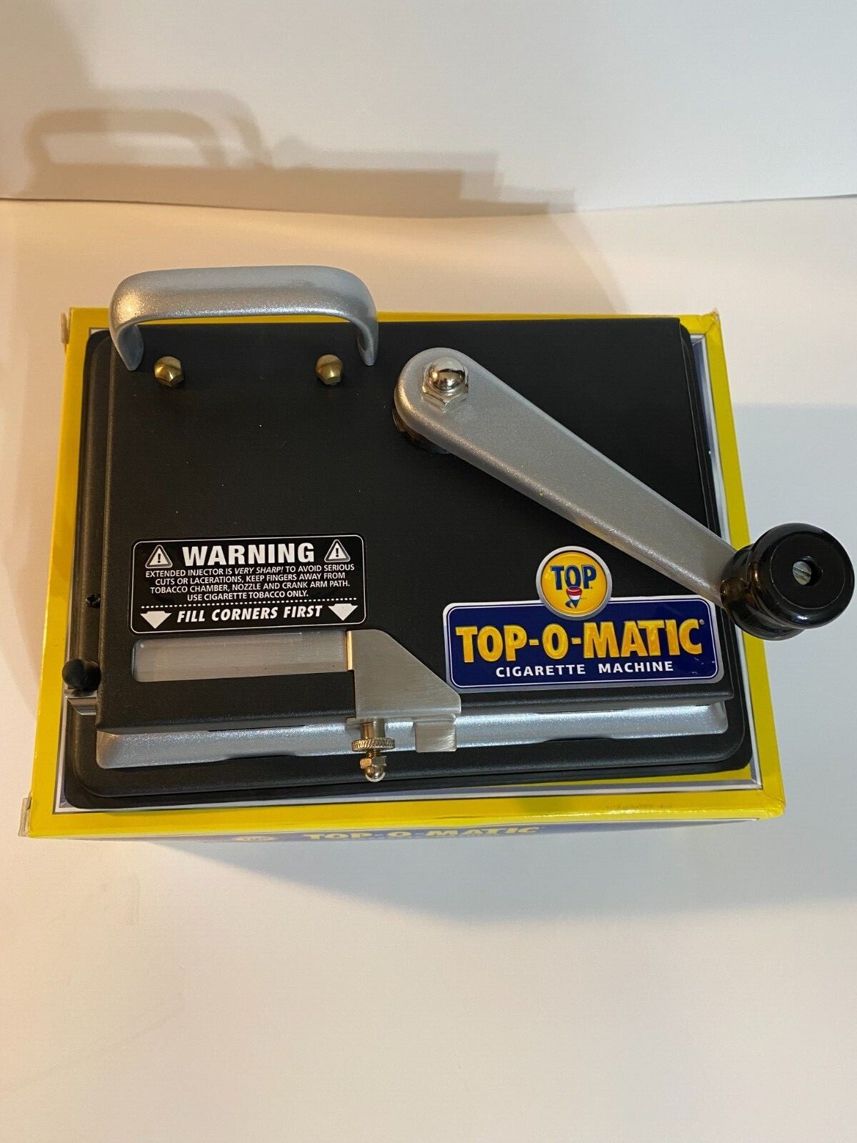 BRAND NEW, OPEN BOX, NEVER USED, TOP-O-MATIC CIGARETTE ROLLING MACHINE.