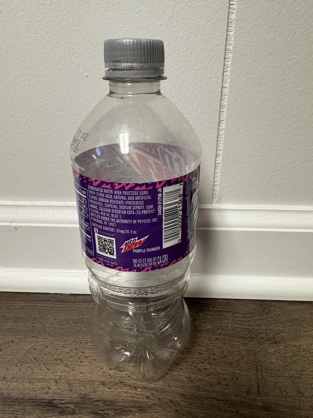 Empty Mountain Dew Purple Thunder 20 oz bottle