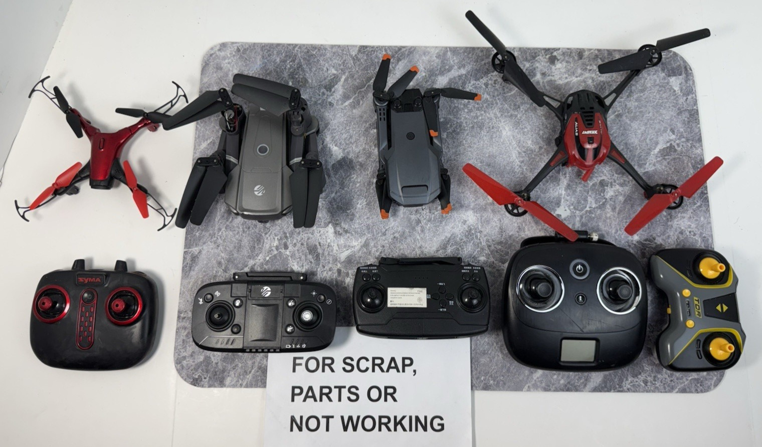 LOT OF 4 Drones Mixed Models w/ 5 Remote Controllers FOR PARTS OR NOT WORKING