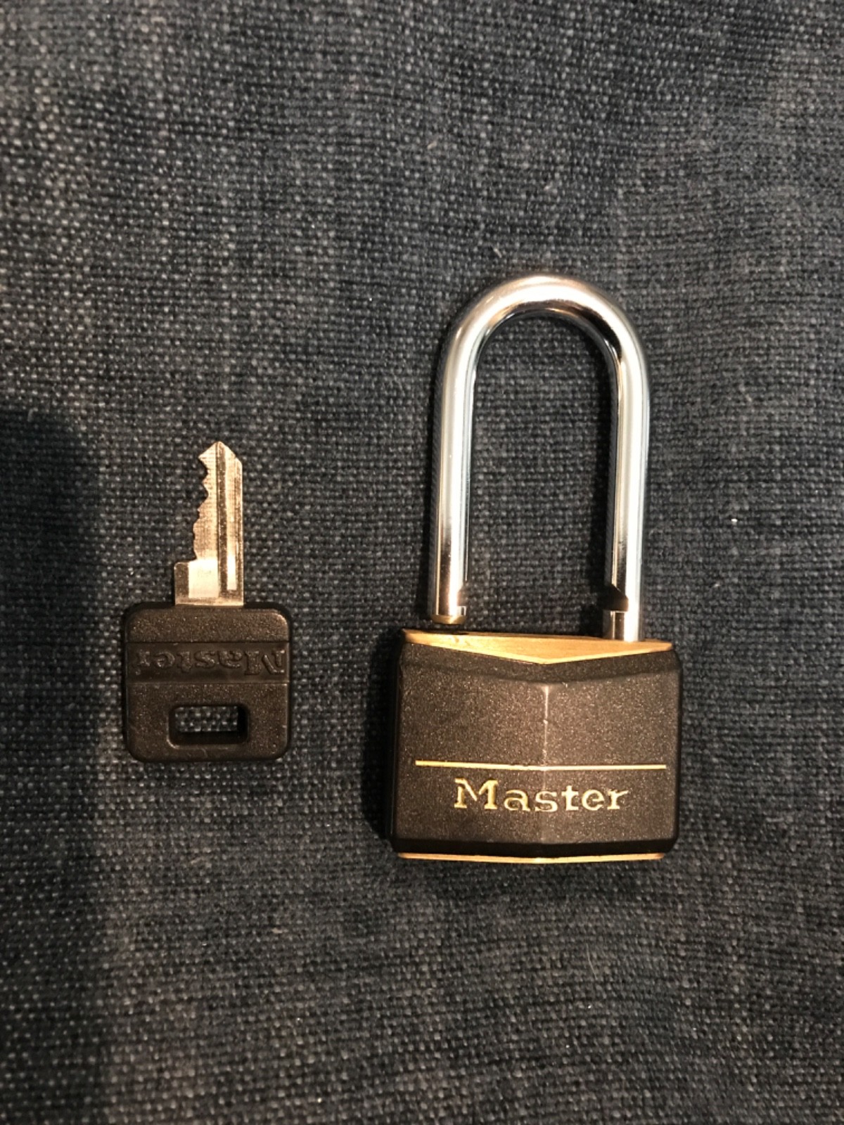 (1) Master Lock 141DLF Black Covered Solid Body Padlock, 1-1/2" Shackle, 1-9/16"