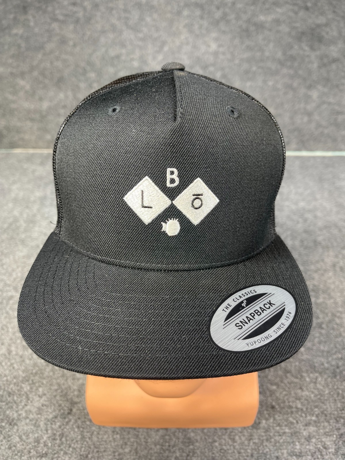 BLōFISH Branded and Logoed Cap Black Trucker mesh snap back closure