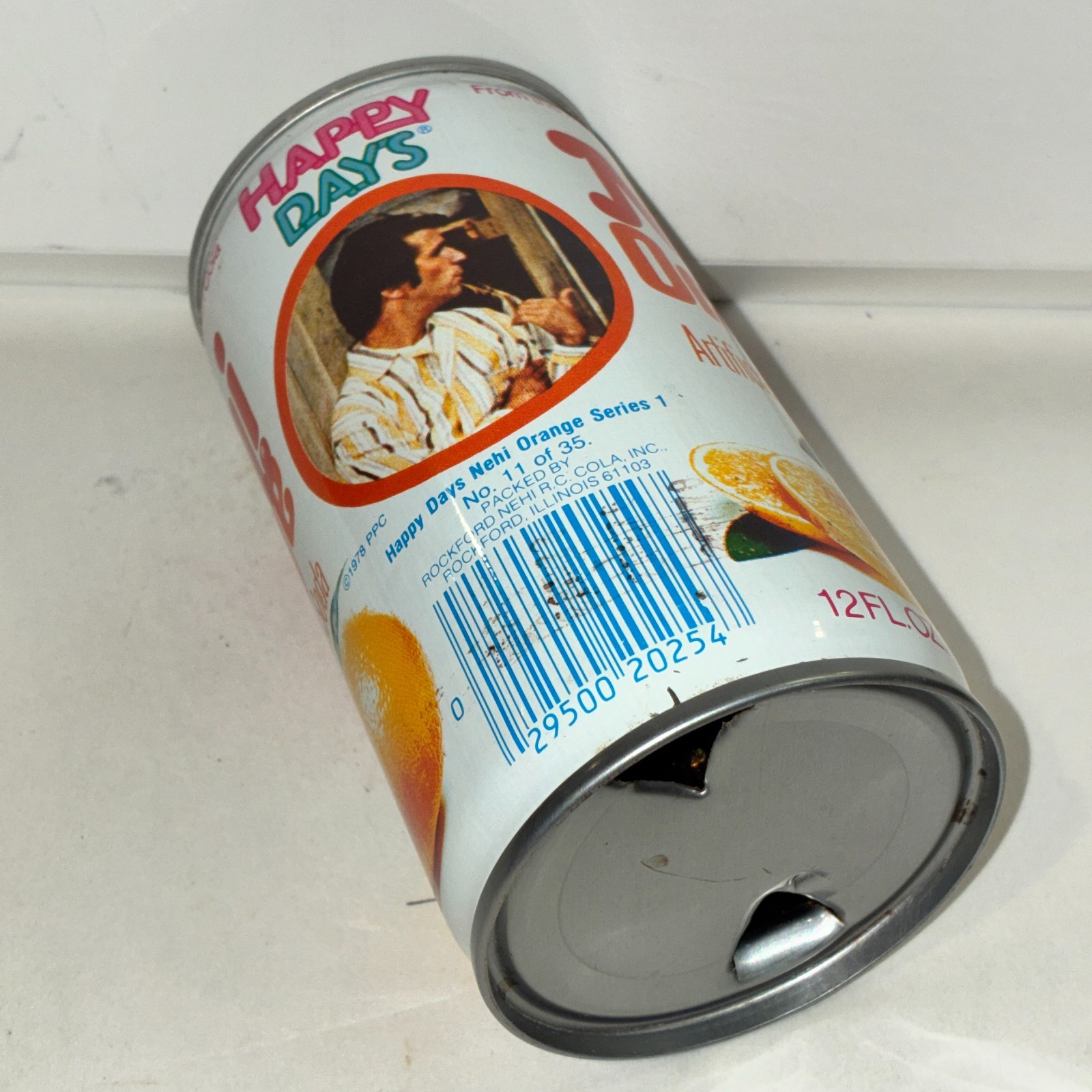 1970's Nehi Happy Days Orange Soda can, #11, bottom opened