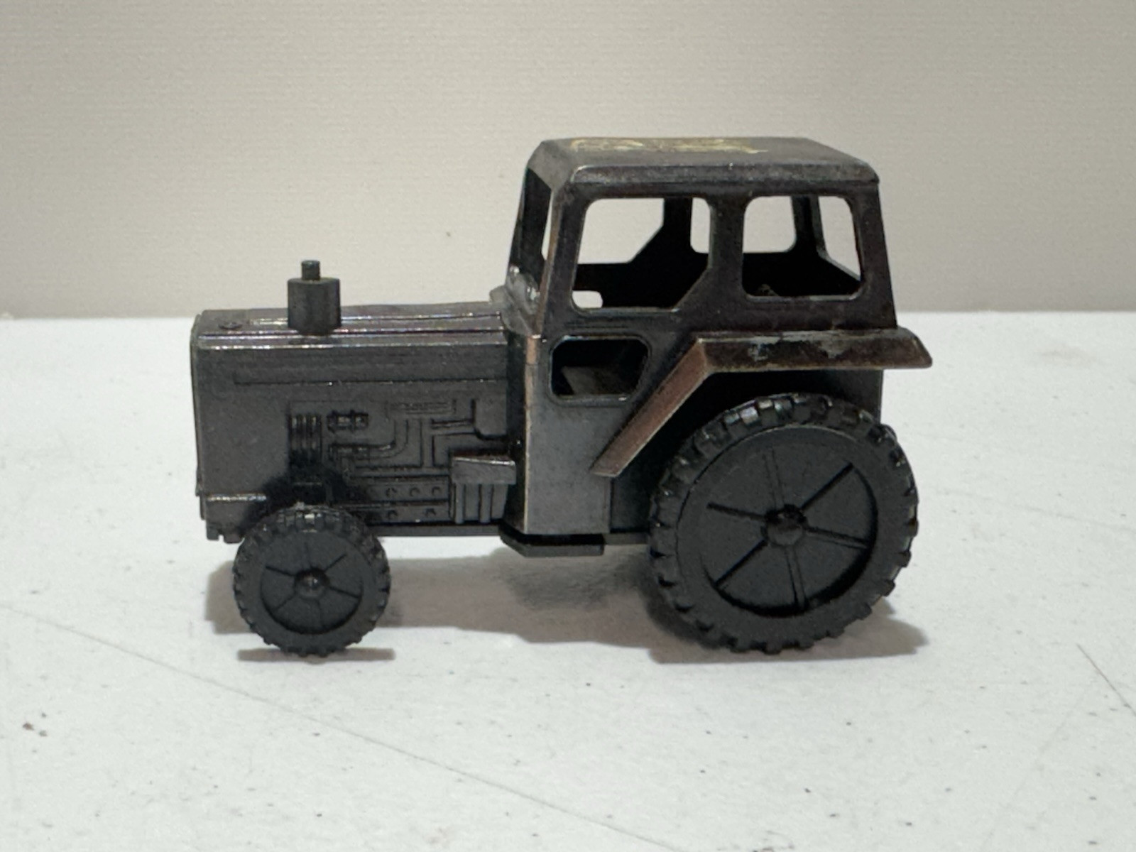 VINTAGE HONG KONG DIE CAST METAL FORD TRACTOR PENCIL SHARPENER