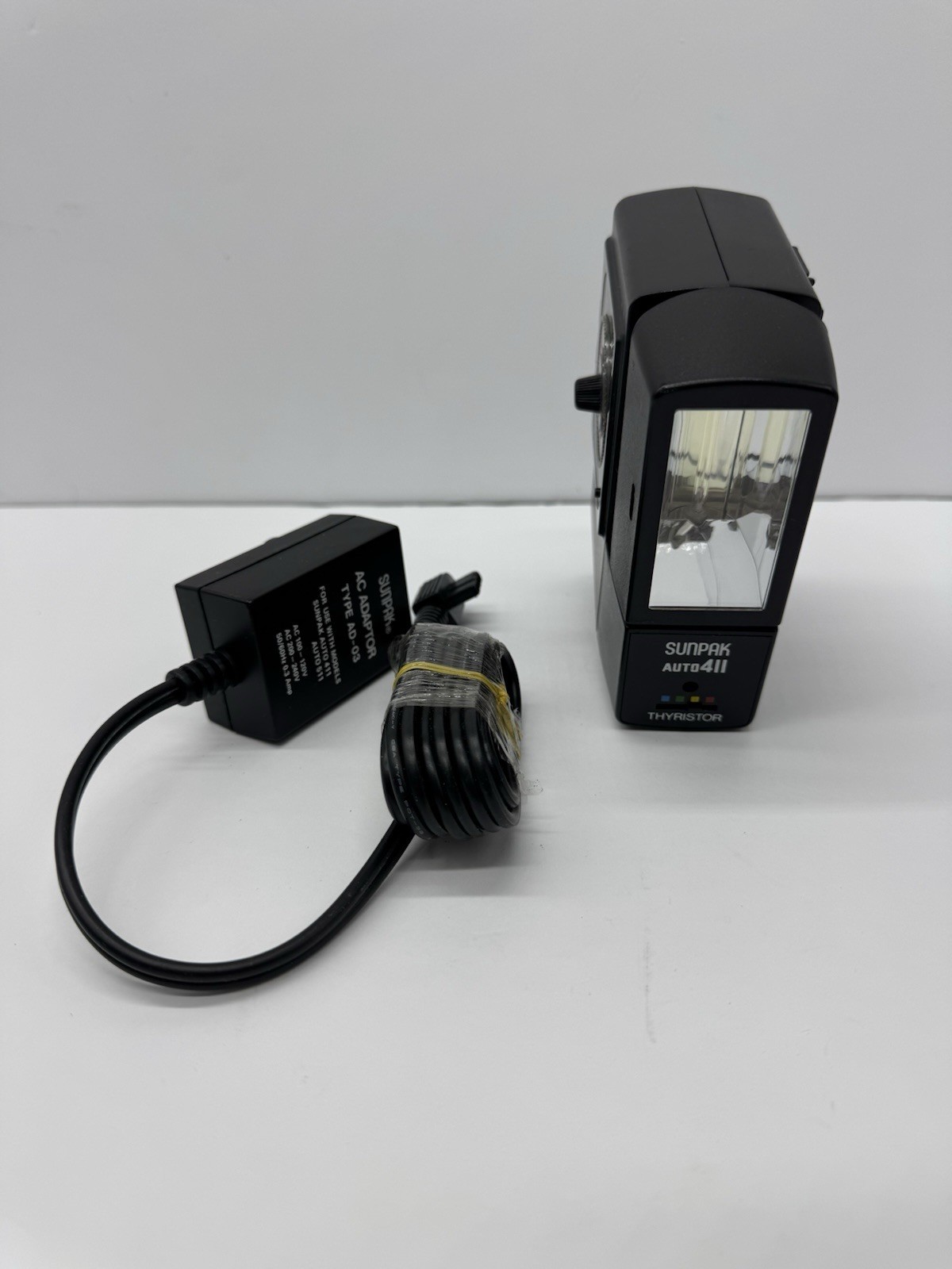 Sunpak Auto 411 Flash w/ AD-03 AC Adapter & Cord Tested Working