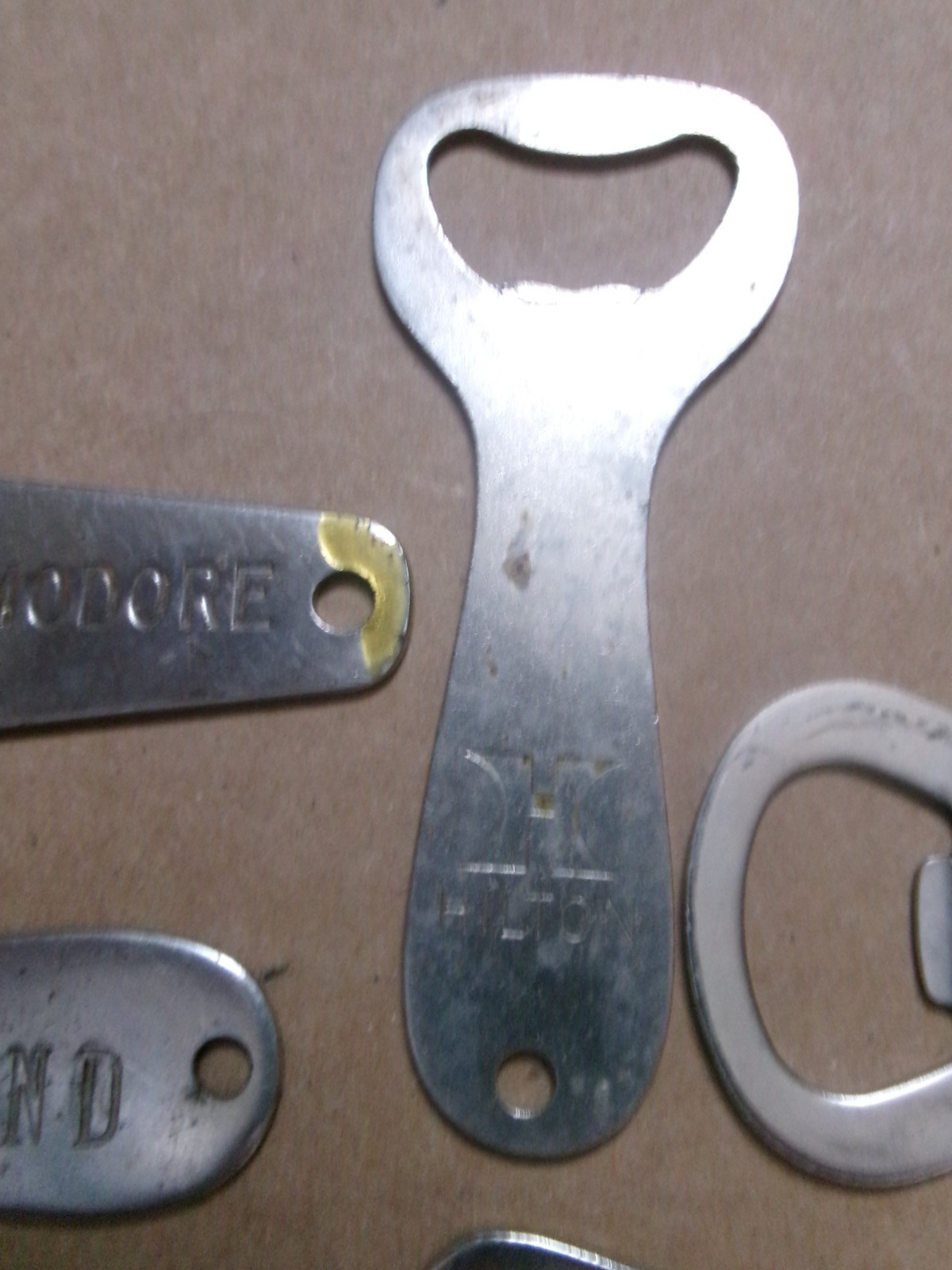 Six Different Hotel Metal Bottle Openers
