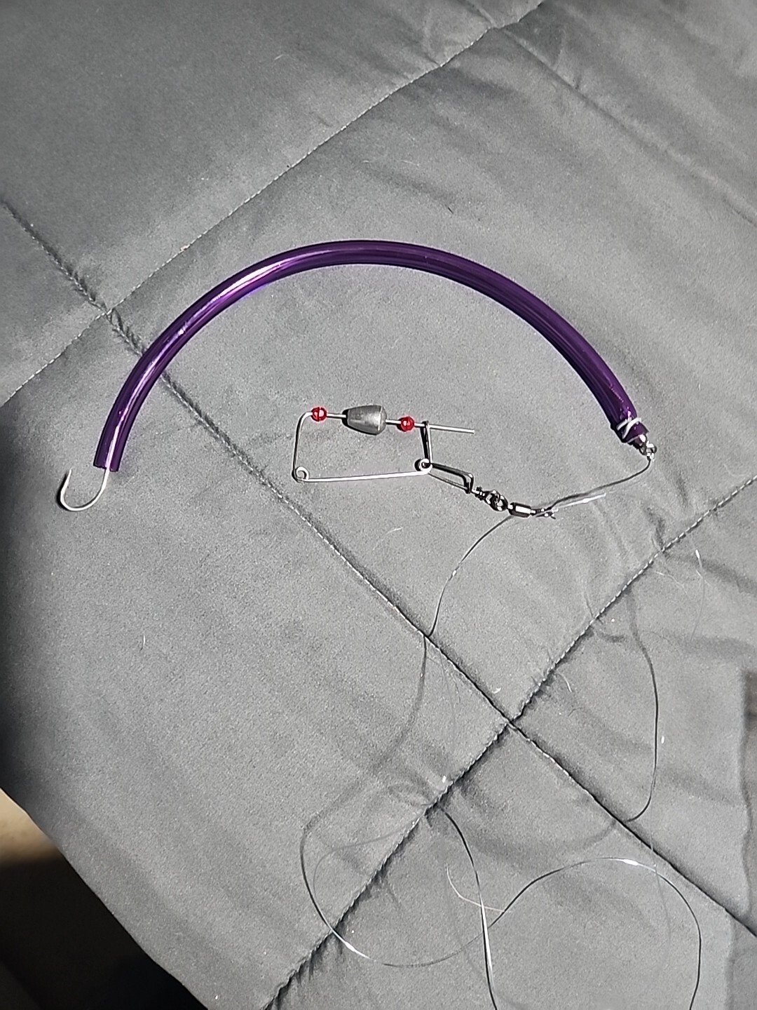 12" Striper Bass Lure Tube, with Rudder and Leader. Tube Color: Dark Purple.