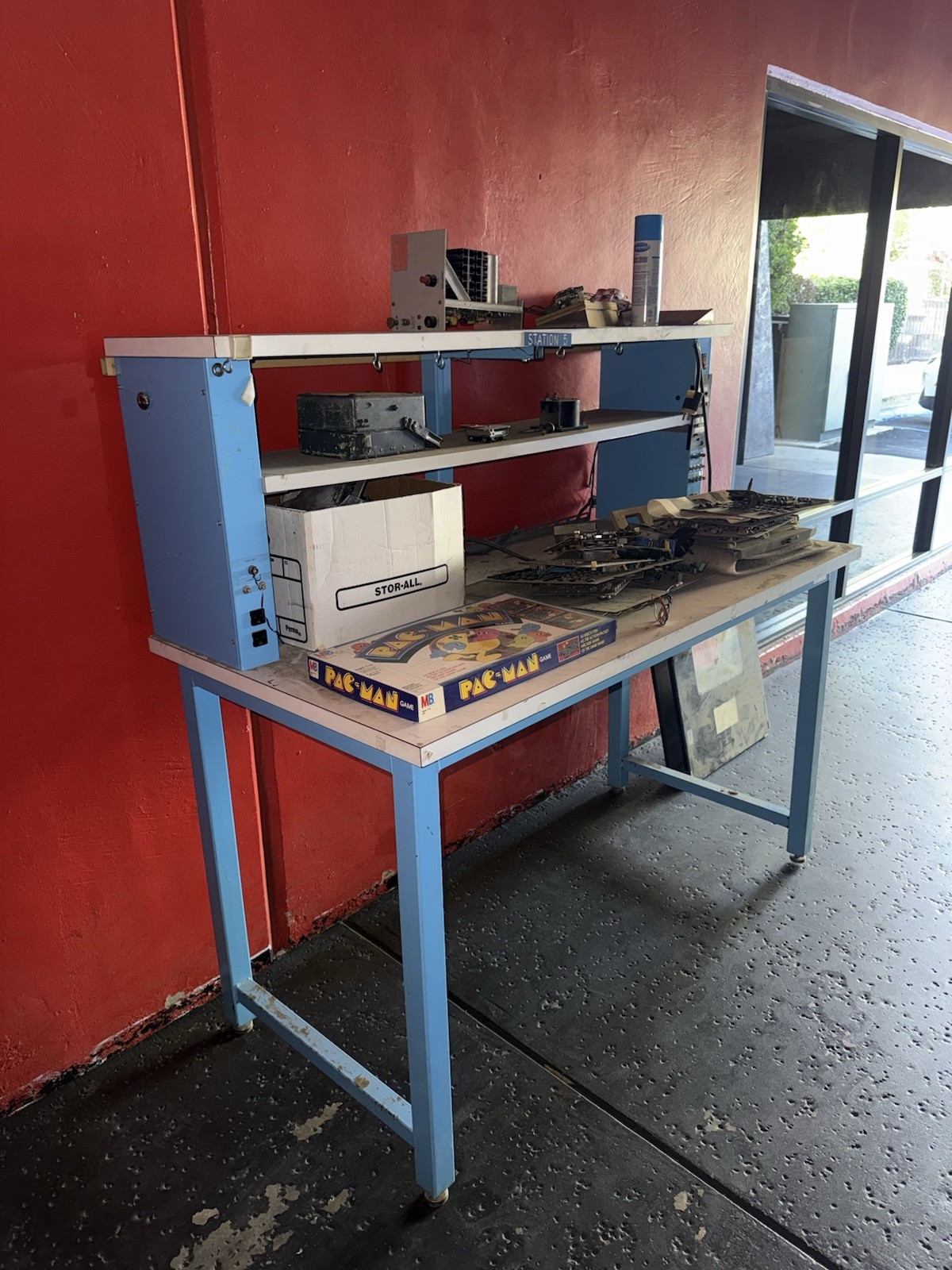 Blue and White Metal Assembly Workstation with Shelving and Worktop
