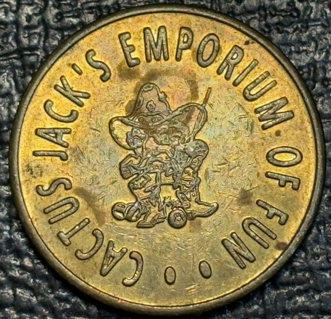 AU CACTUS JACK'S EMPORIUM OF FUN KAMAS VENDING CO. OKLAHOMA CITY OK. TOKEN-MAR77