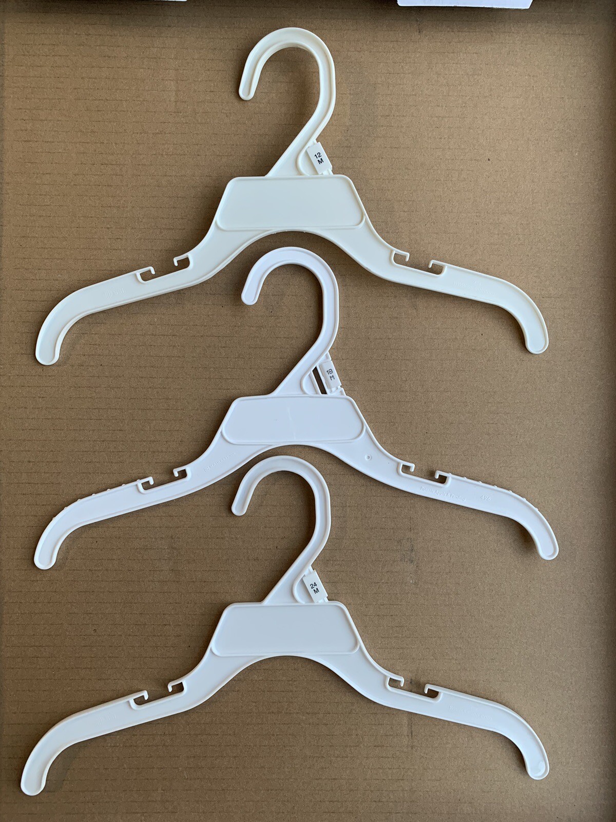 Plastic 12 Inch Hangers With Size (12/18/24 Month) Lot Of 30