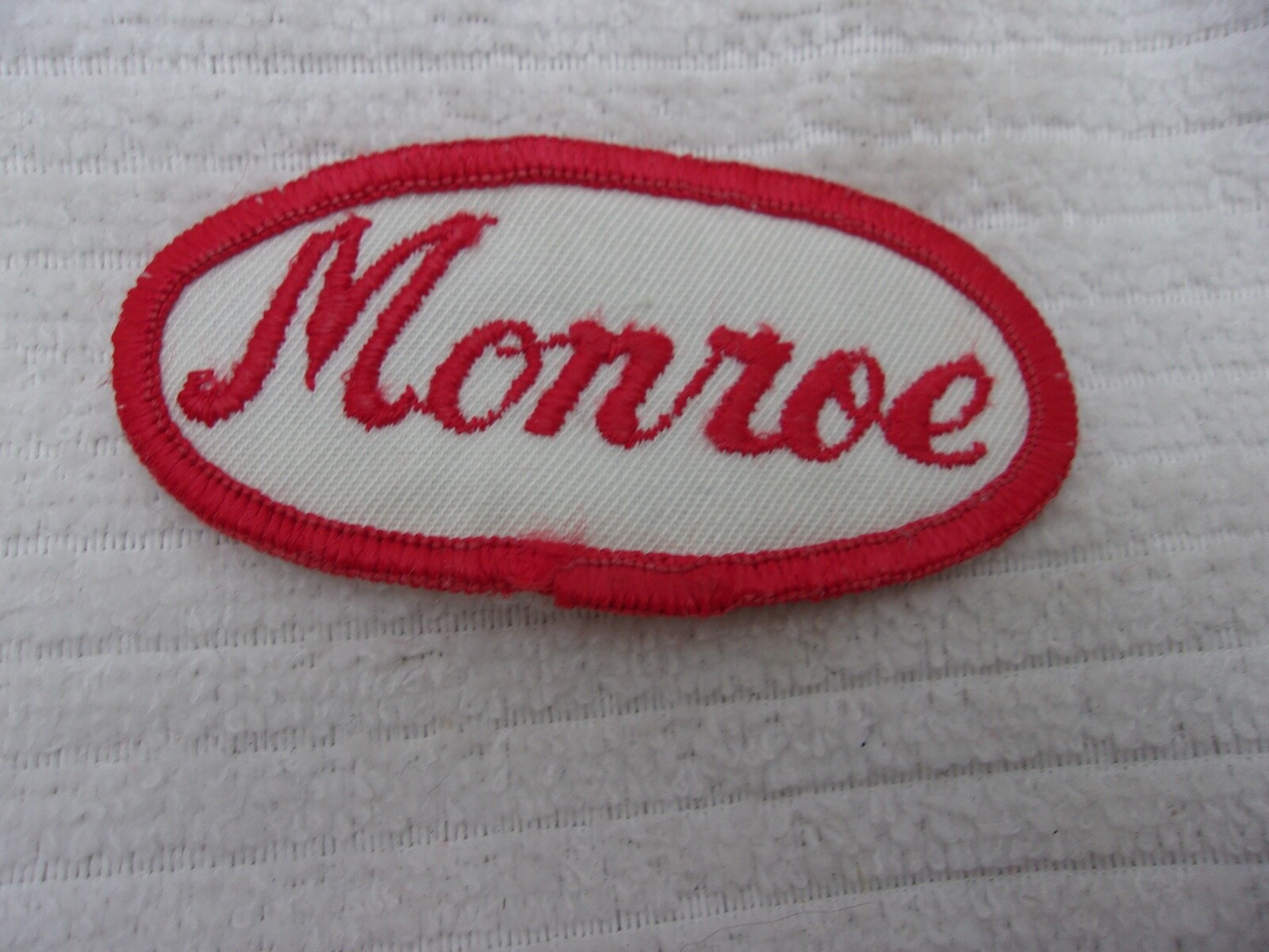 MONROE USED EMBROIDERED SEW ON NAME PATCH TAG OVAL RED ON WHITE