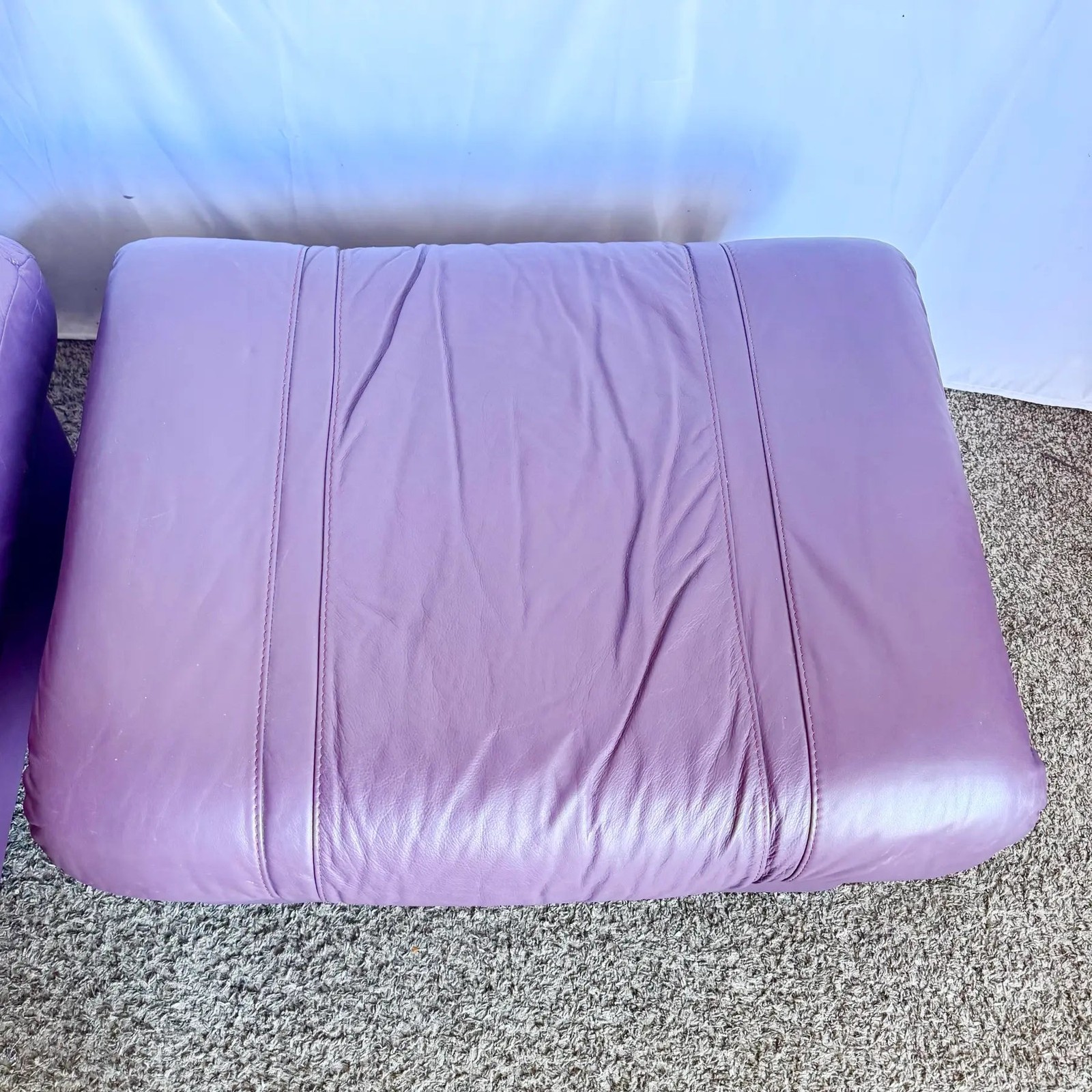 Vintage Italian Purple Leather Ottomans on Castors - A Pair