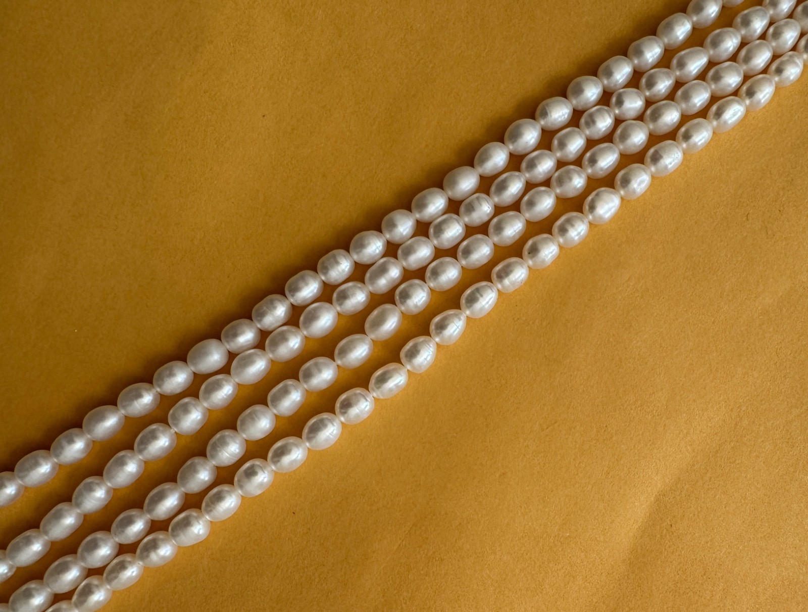 A full string of 15" fresh water pearl, oval , white , 5-6 mm