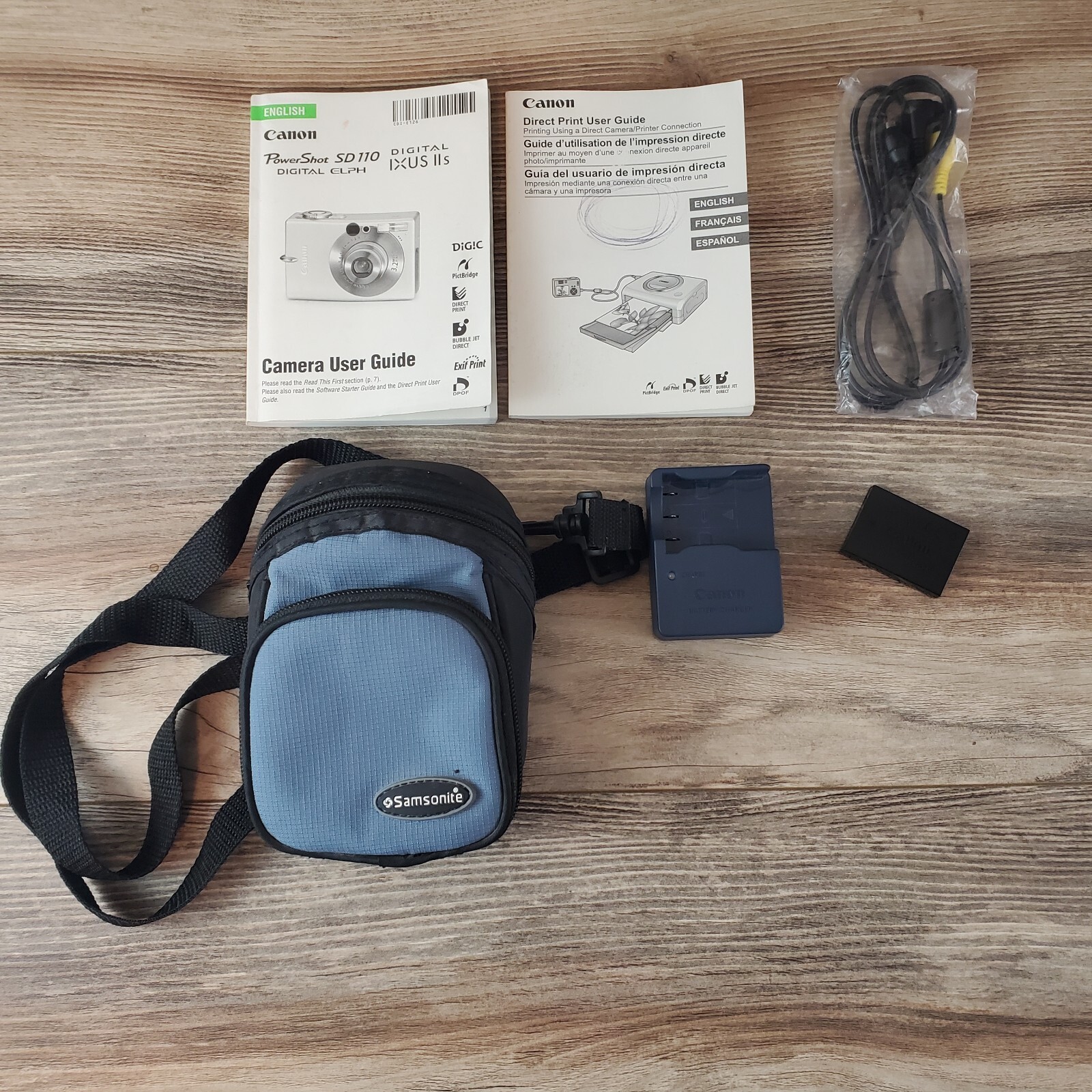 Accessory lot For Canon PowerShot SD110 ~ Includes Battery, Charger, Case & book