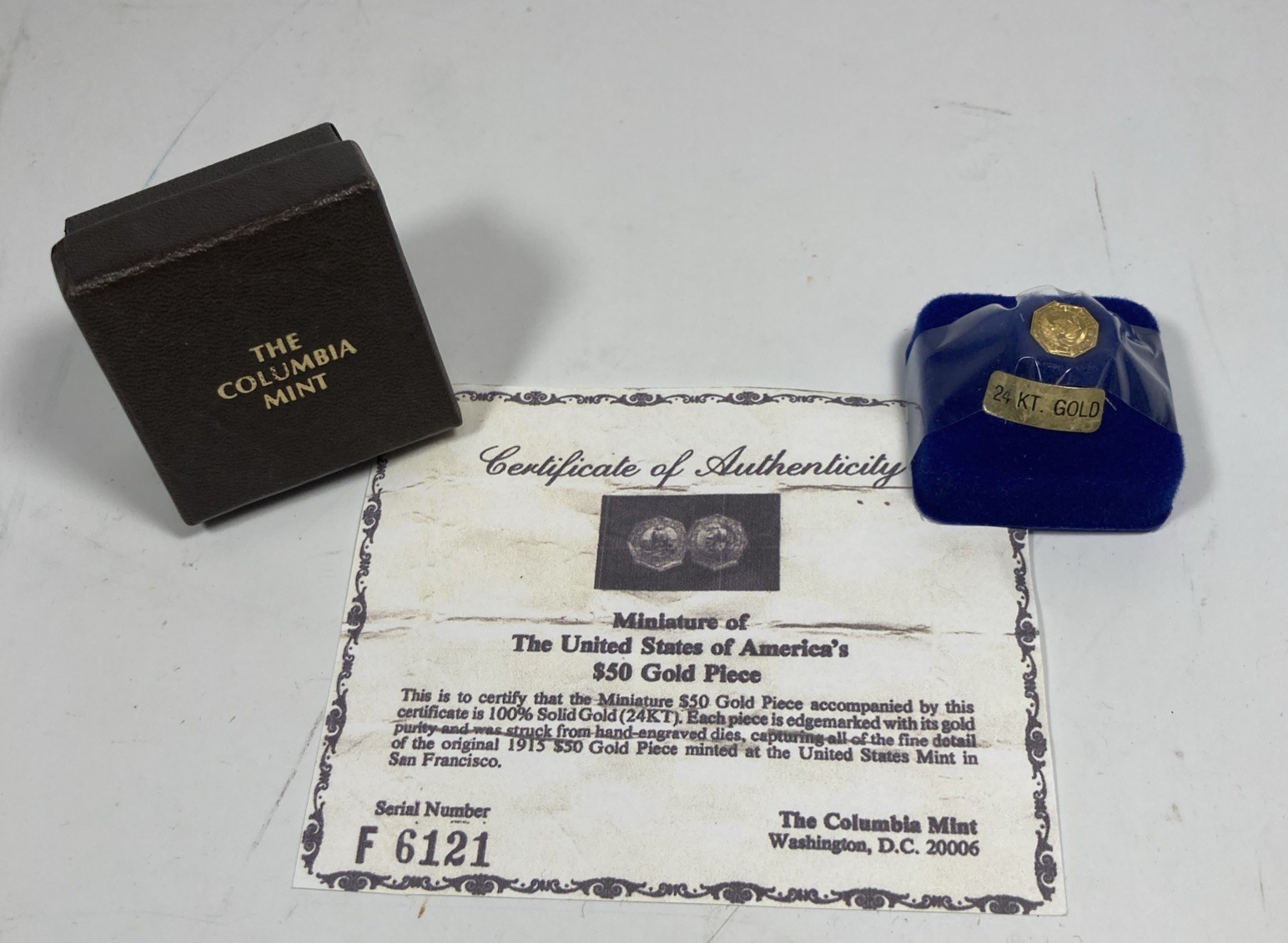 Columbia Mint, Miniature $50 Gold Piece. 24K Gold .66 gr .021oz AGW