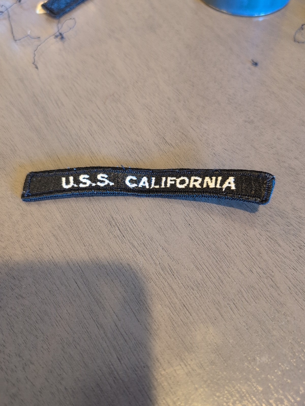 USS California Uniform Shoulder Patch - Rocker. Used. Light Wear