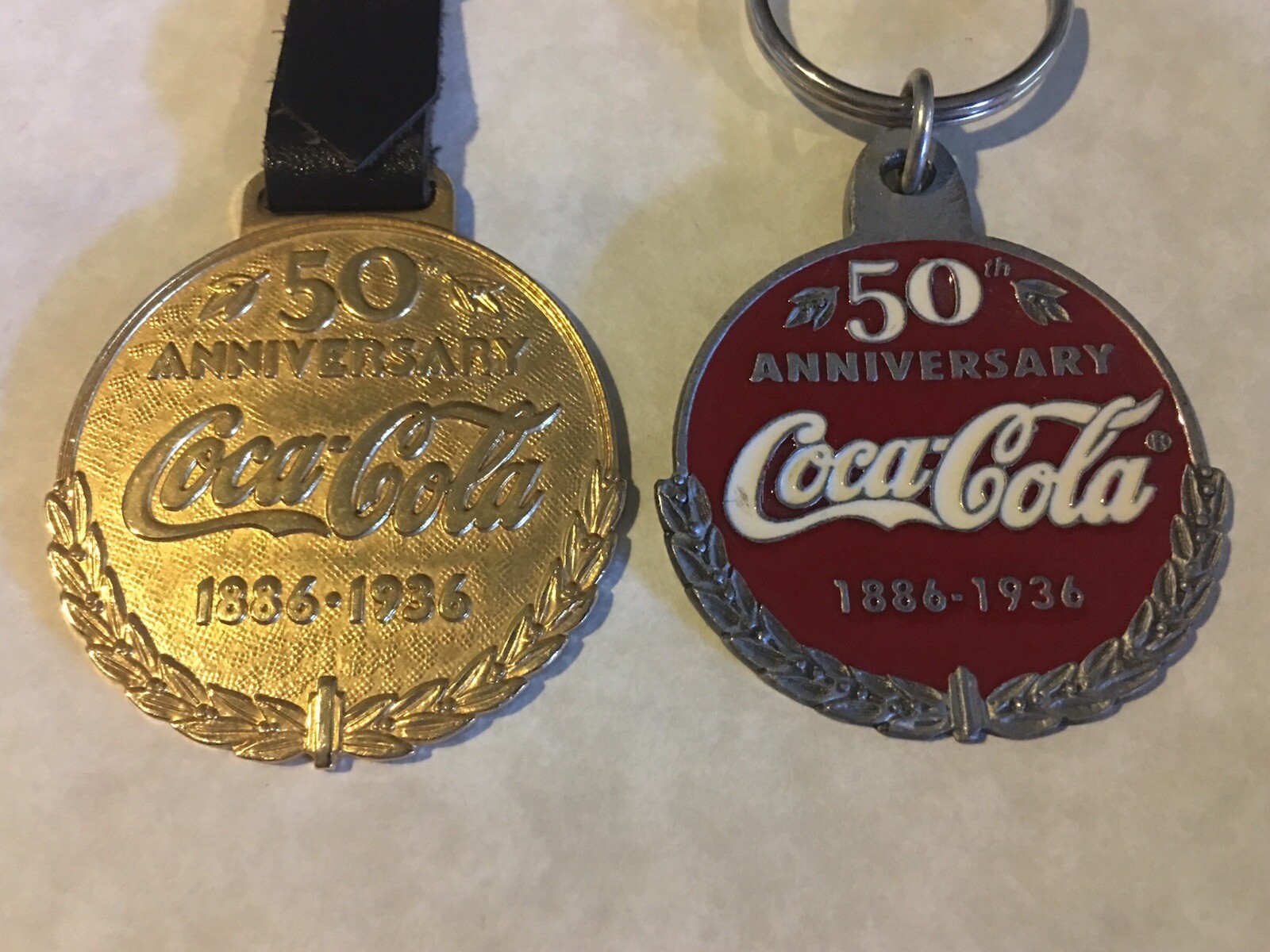 Lot of 2 Coca Cola 1886-1936 50th Anniv Bronze (or Brass?) Round Bar Coin Fob