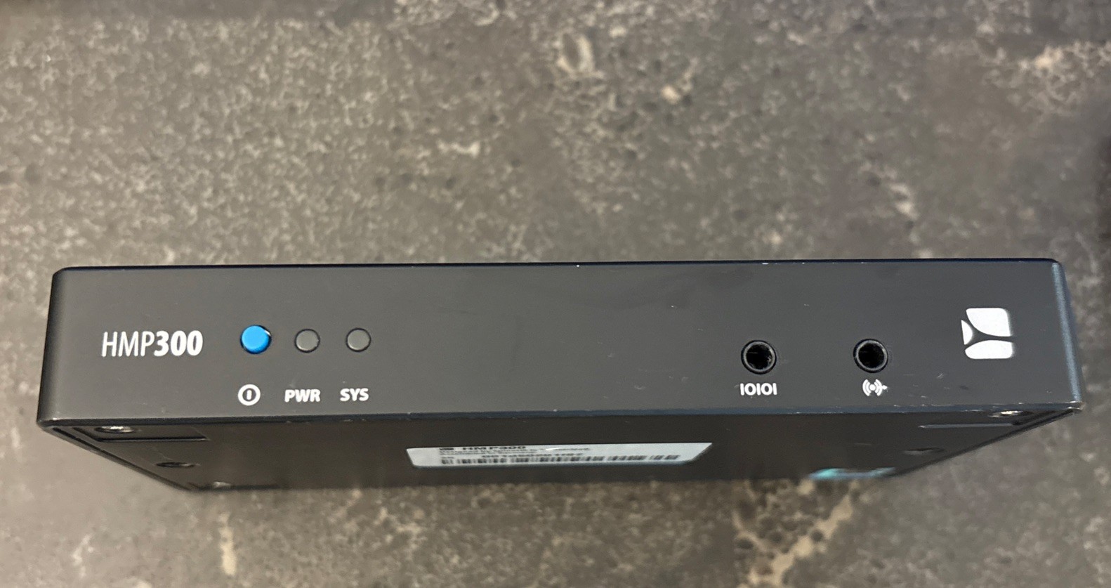 The SpinetiX HMP300 High-End Digital Signage Player is packaged with a charger.