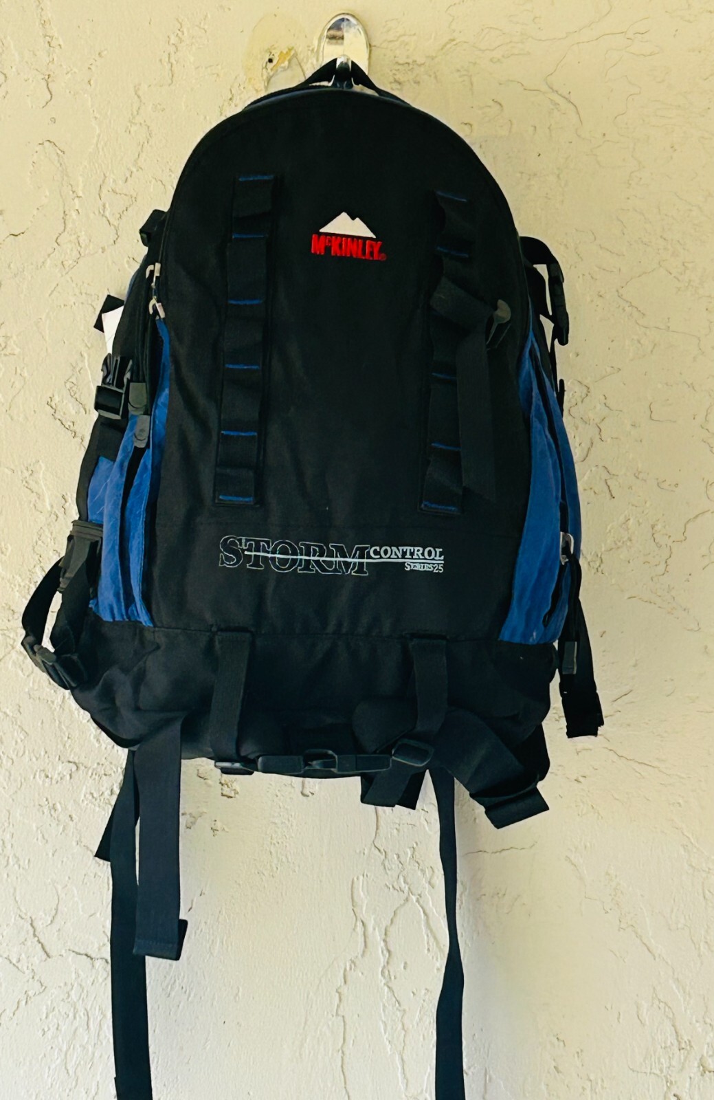 McKinley Hiking Camping Storm Control Backpack (Blue, Red and White)