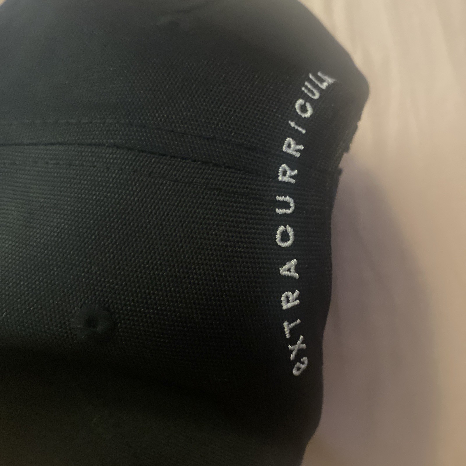 Extracurricular Golf Flexfit SnapBack Hat embroidered logo black