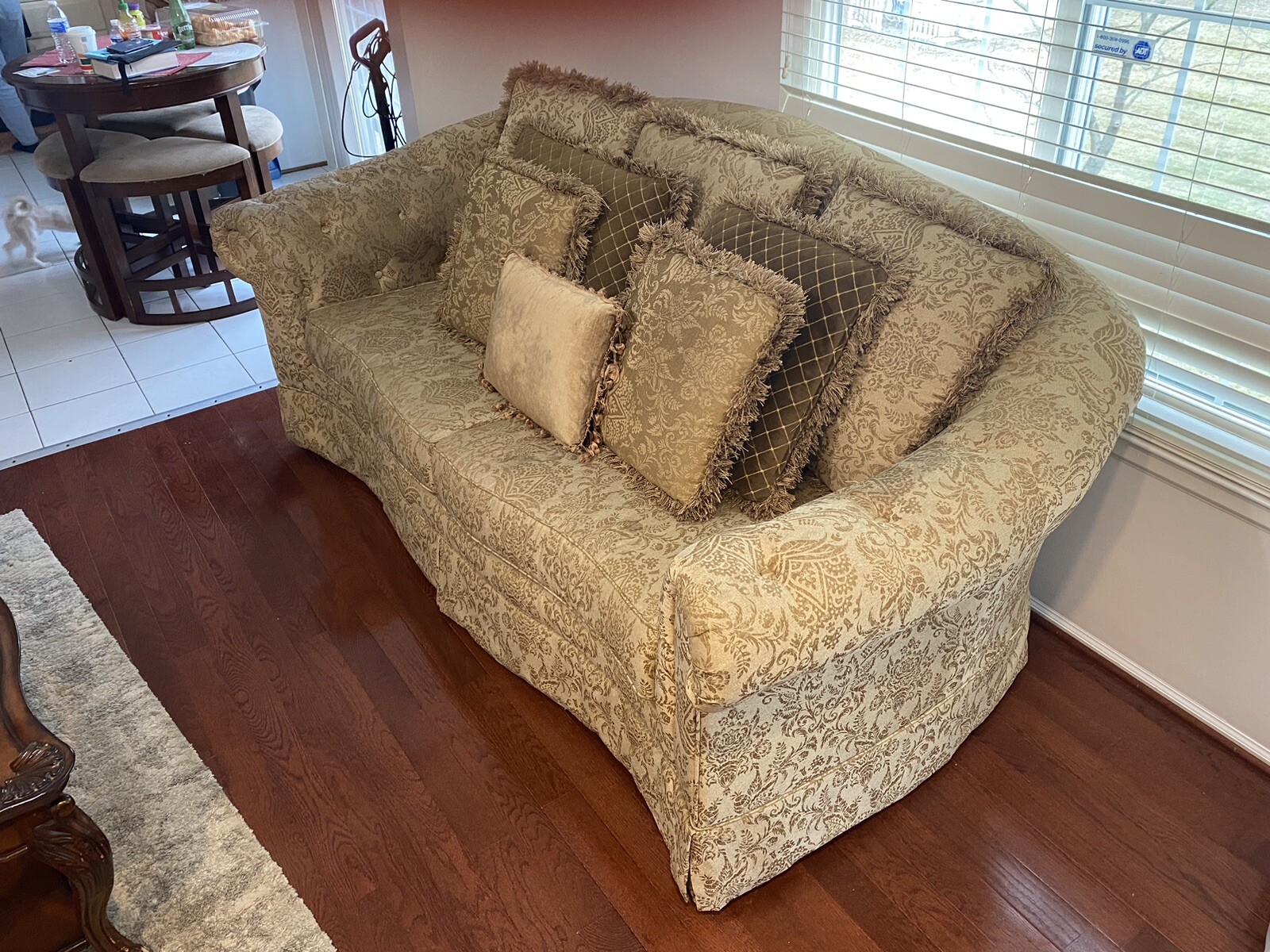 A Set Of Beige Sofas And A Coffee Table