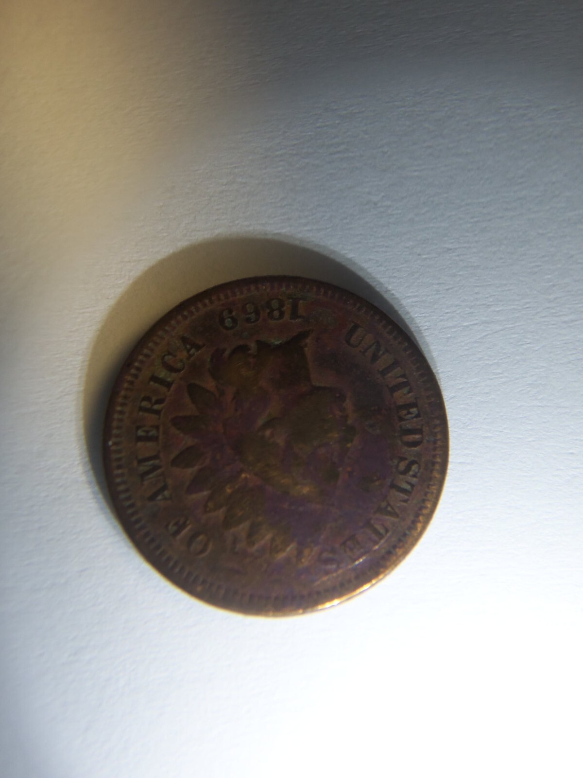 A RARE 1869 INDIAN HEAD PENNY