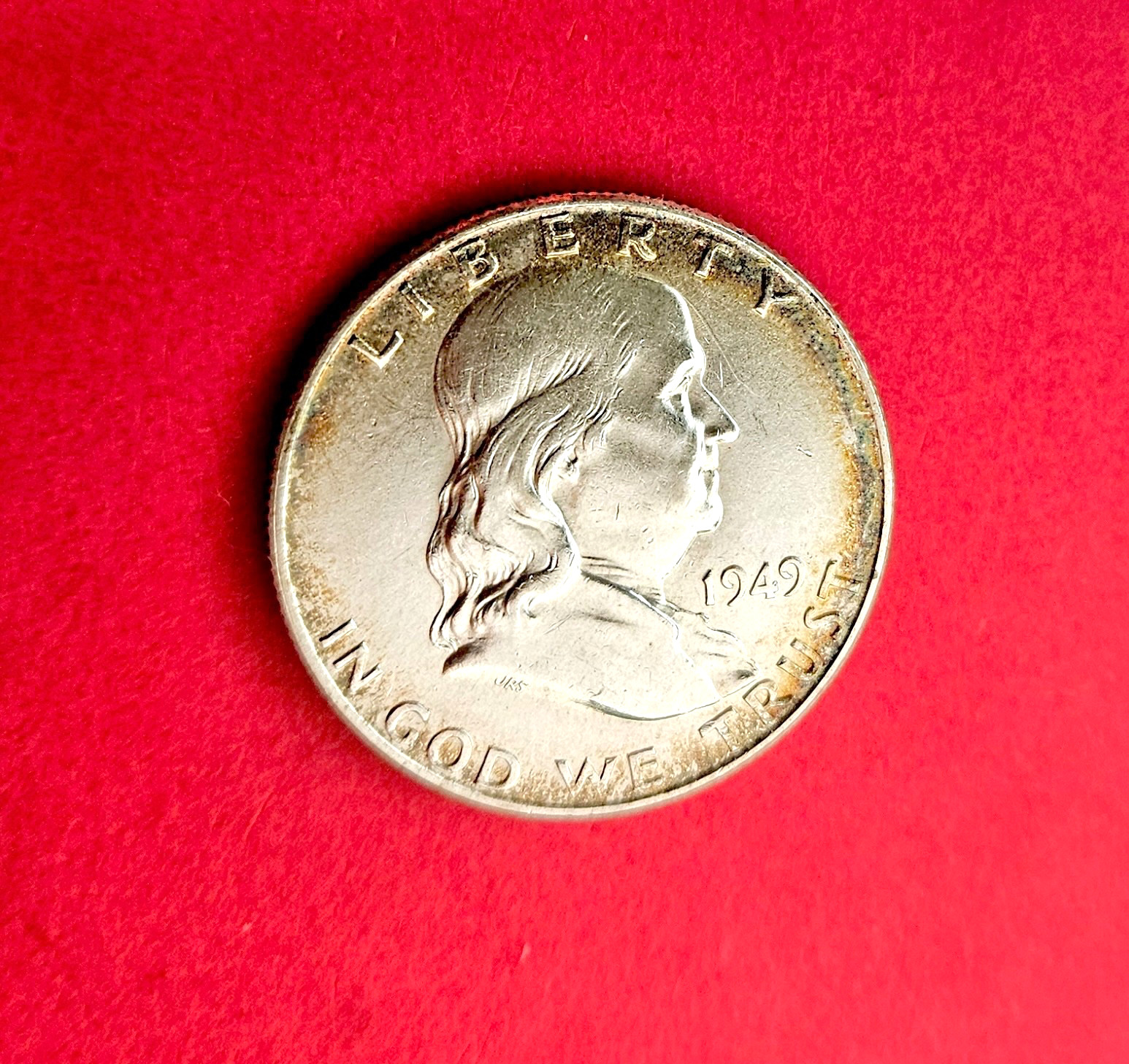 1949 Franklin Silver Half Dollar. EF. 90% Silver. Toned. Nice Bell Lines.