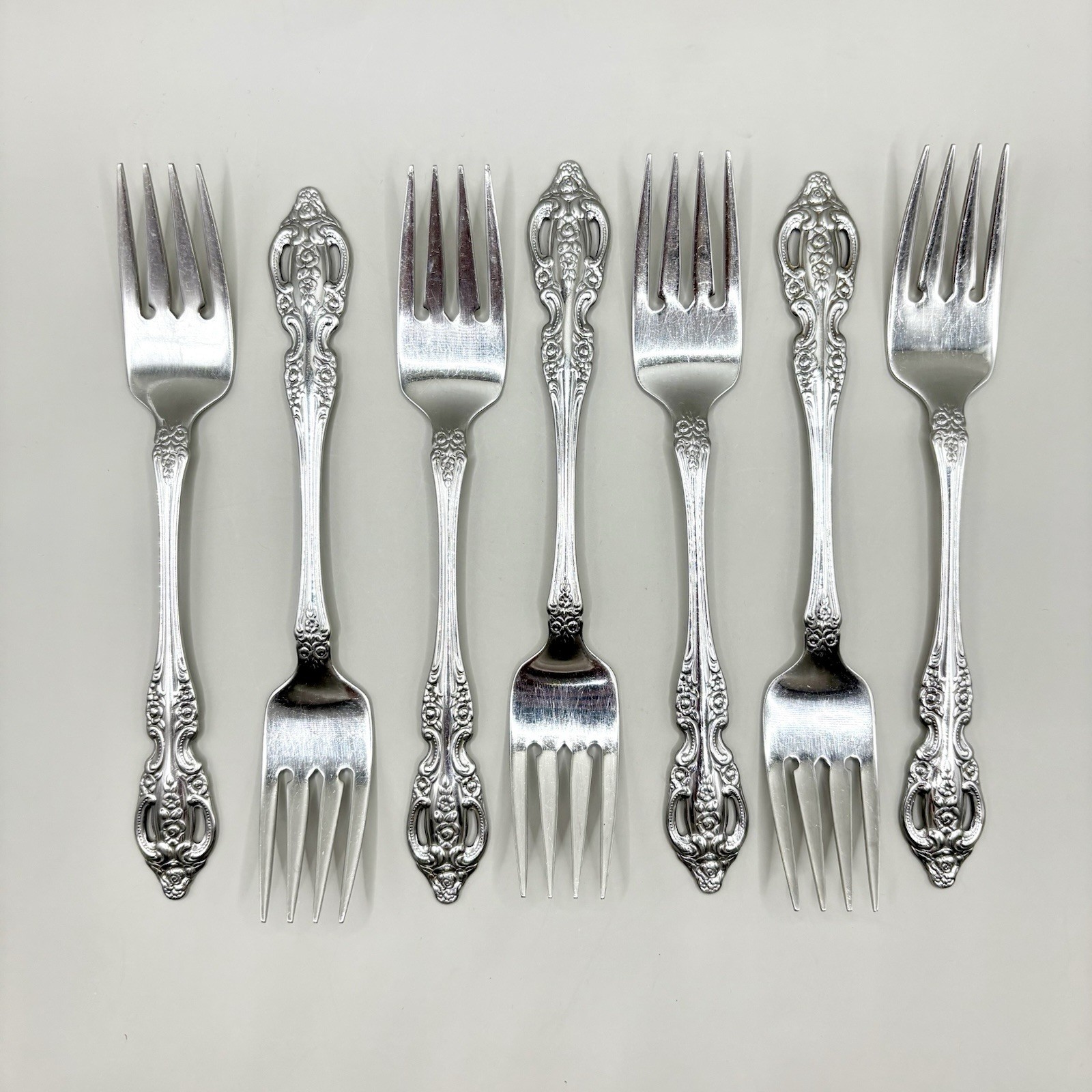 Oneida Renoir Pembroke Stainless Salad Forks Set of 7 SSS Pierced Floral