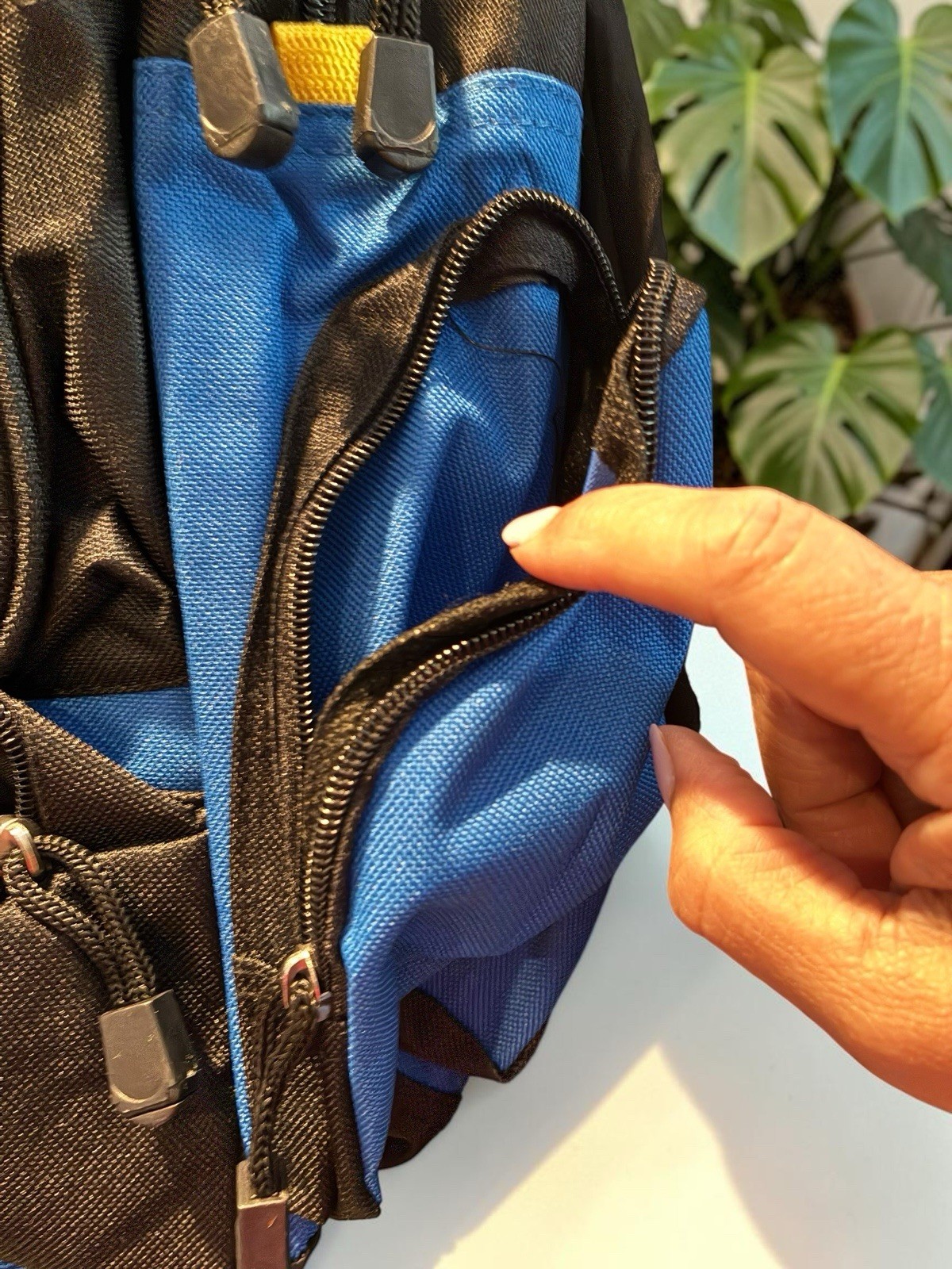 Black And Blue Backpack With Many Pockets.