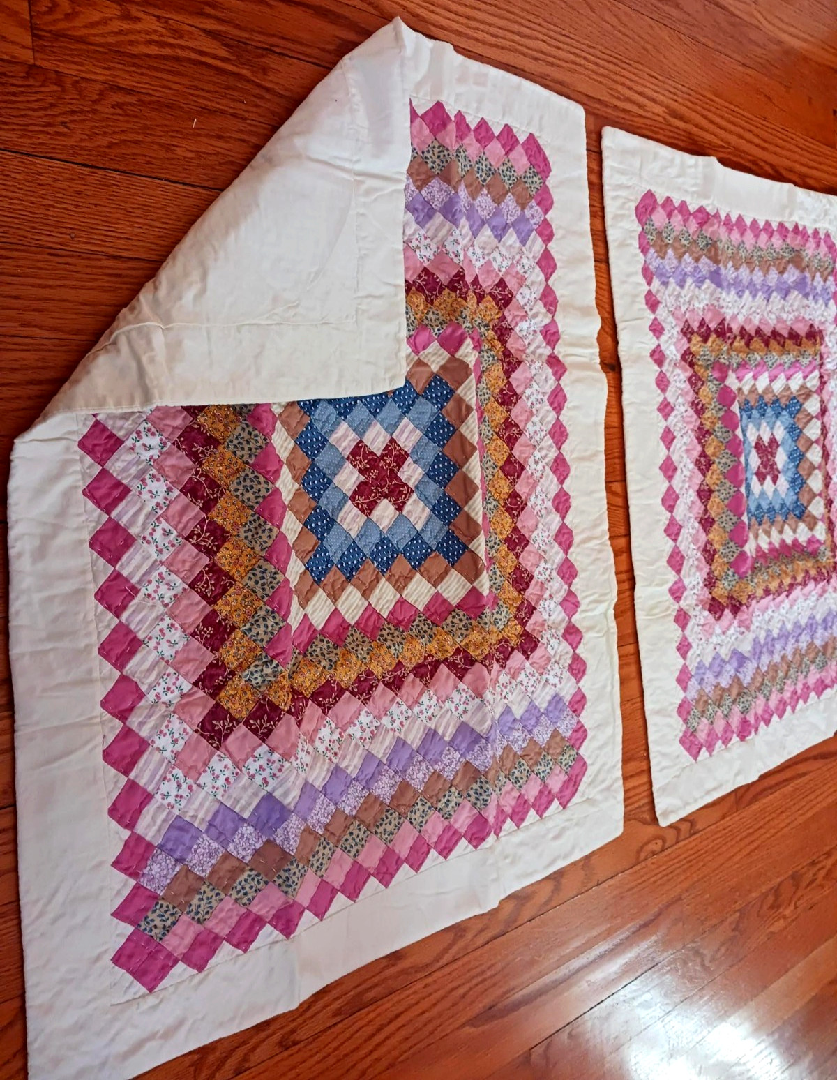 Two quilted patchwork pillow shams, 20" × 26"