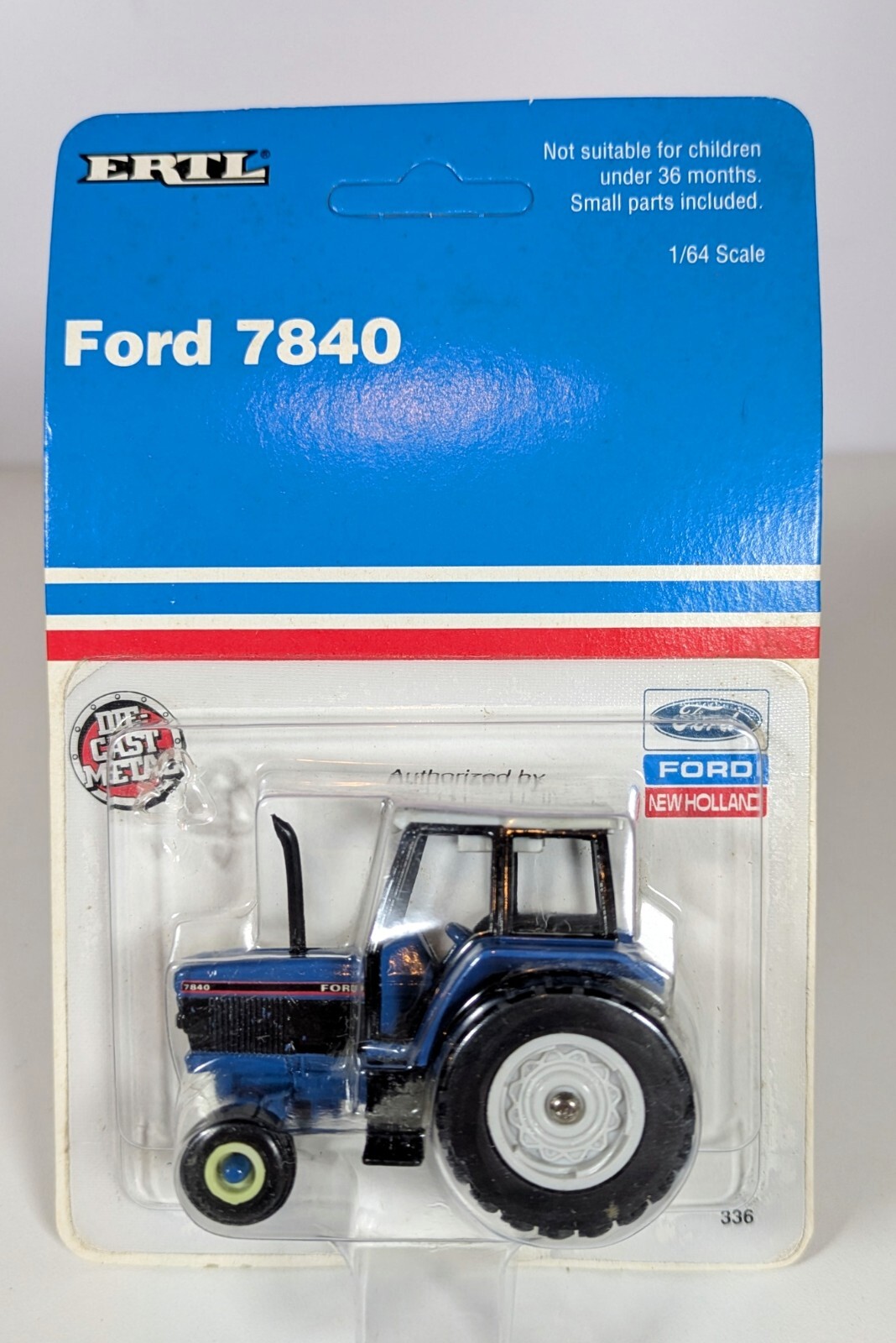 1/64 Ford 7840 Tractor w/cab, 2WD. New on card