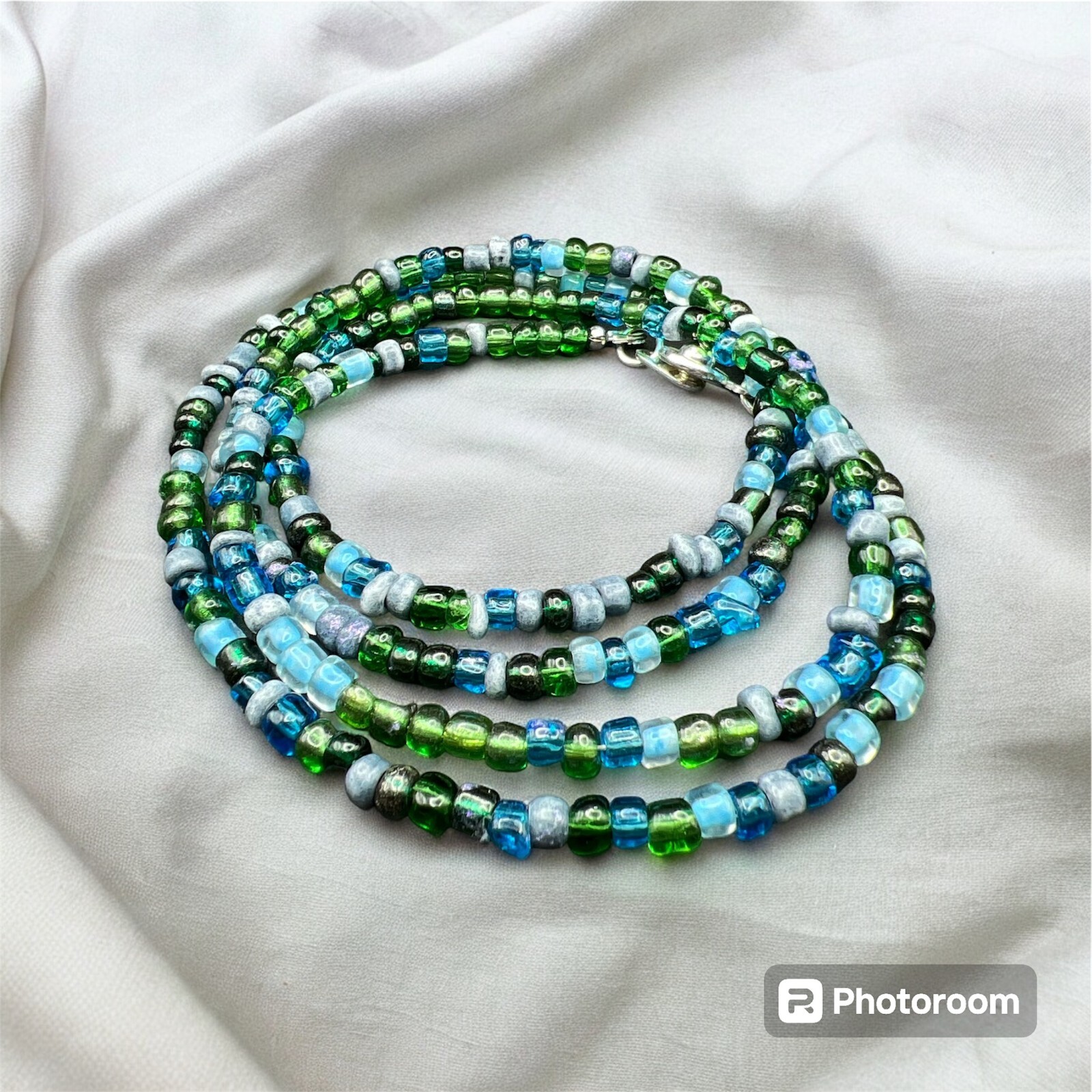 30" glass beaded wrap bracelet in shades of blue with silver snap closure